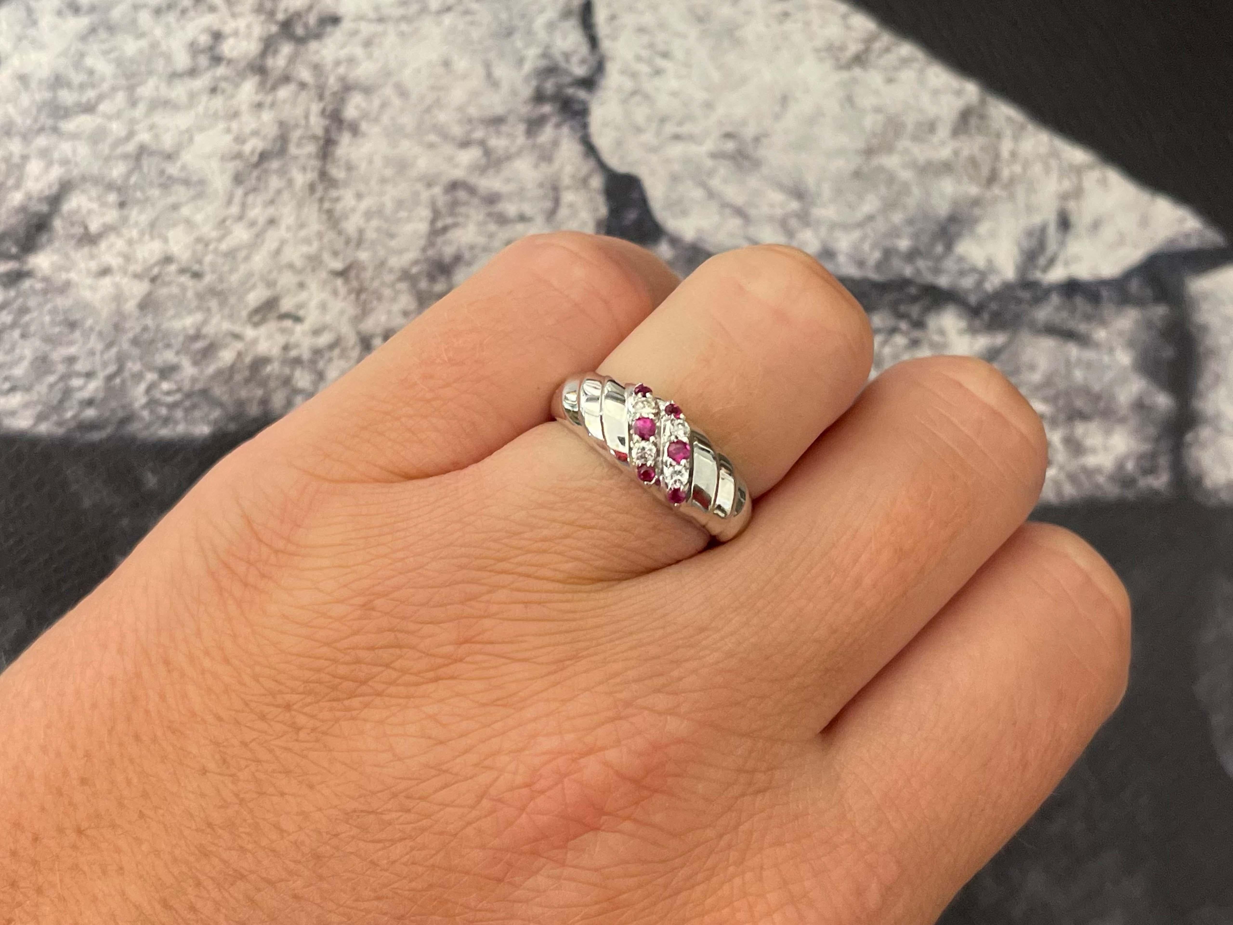 Item Specifications:

Metal: 14K White Gold

Style: Statement Ring

Ring Size: 6.5 (resizing available for a fee)

Total Weight: 3.5 Grams

Gemstone Specifications:

Gemstones: 4 red rubies

Ruby Carat Weight: 0.10 carats

Diamond Carat Weight: 0.10