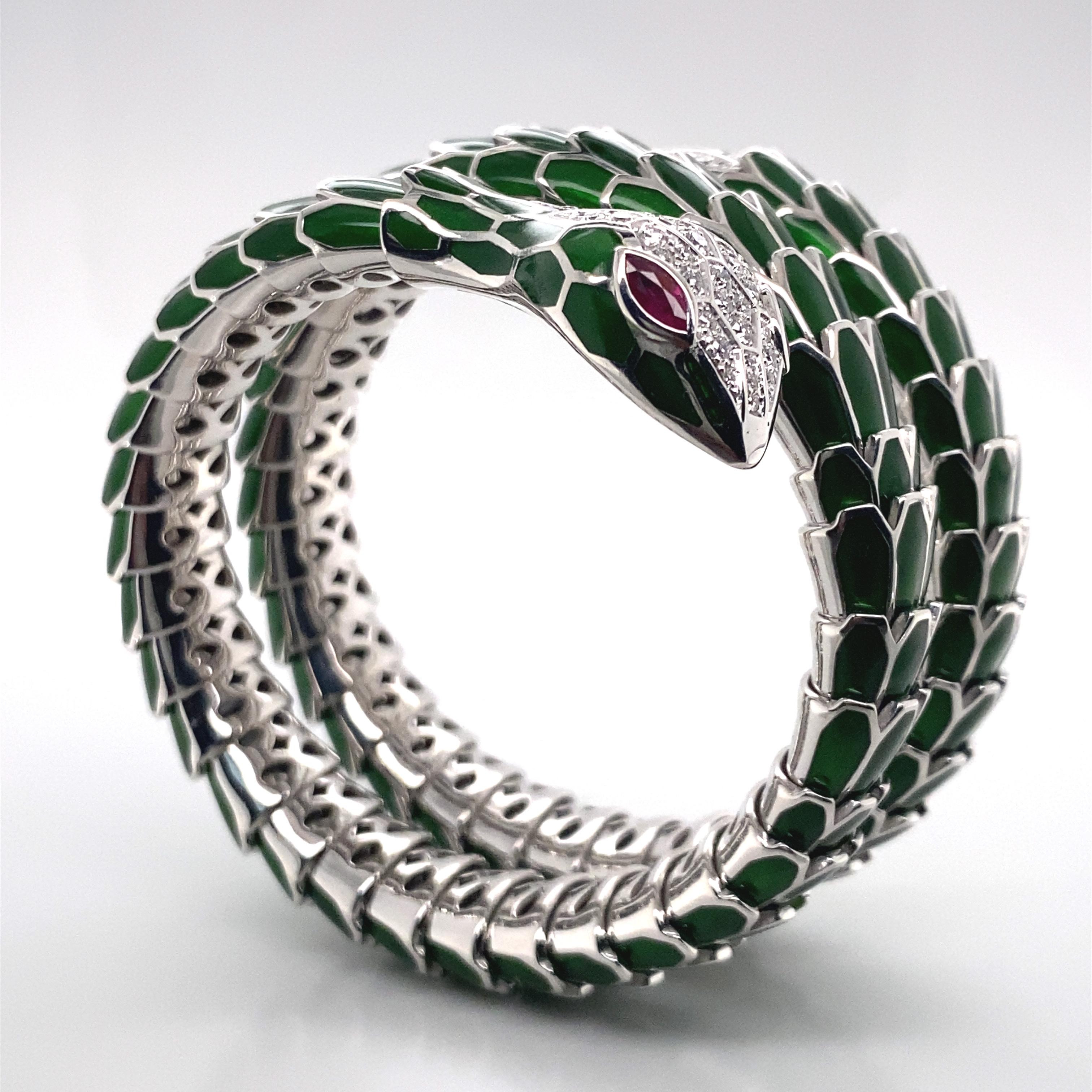 Set with Marquise cut Ruby eyes. Weighing 0.20 ct and detailed with round diamonds weighing approx. 0.70 ct. Green enamel Scales mounted in 18k White Gold and sterling silver. Inner Circumference 5.75 inches with Italian assay mark. 6in- 7.50 in