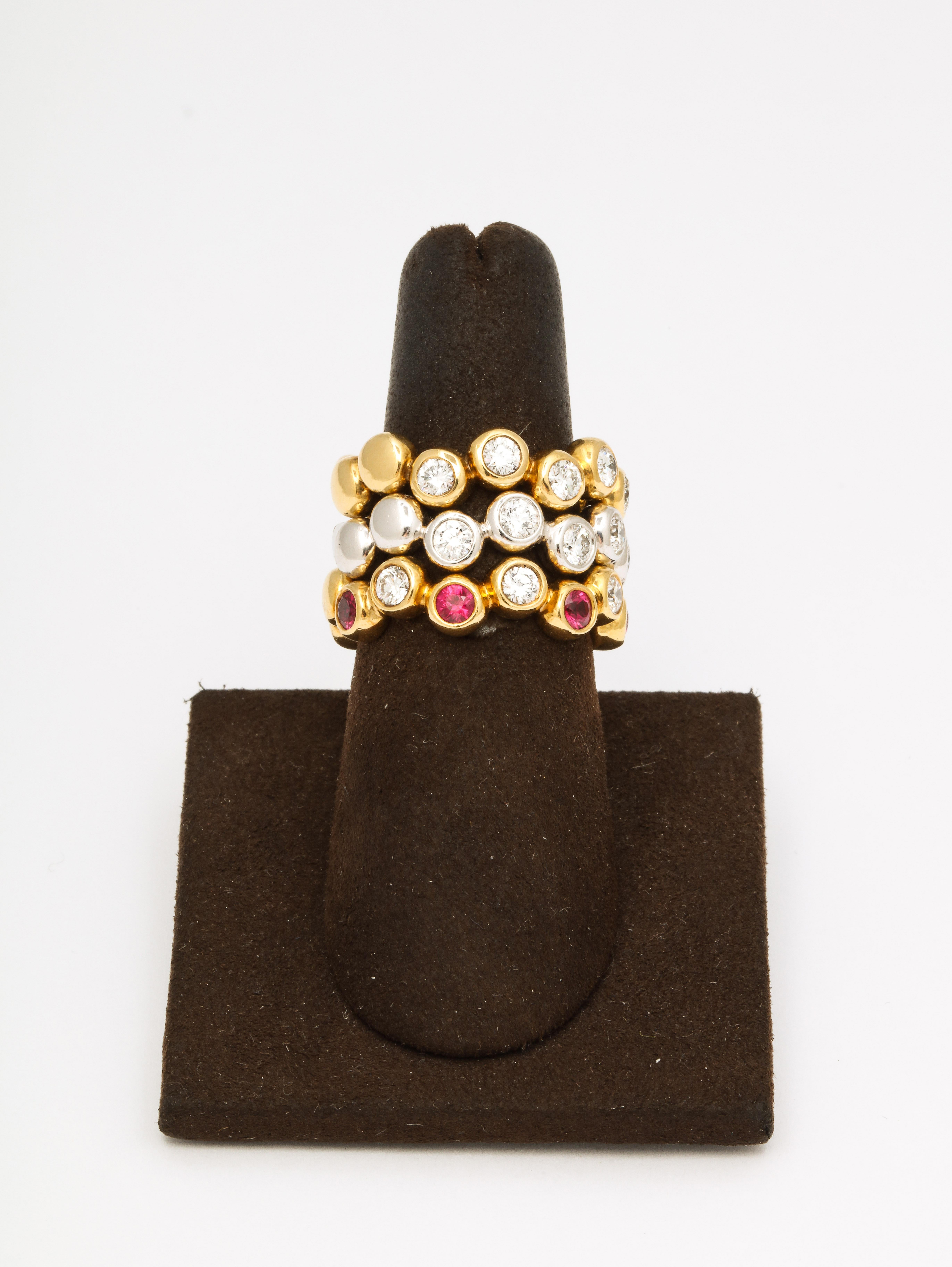 
A beautiful and versatile set of (3) stacking rings. 

Fabulous worn together or individually!  

A total of 1.60 carats of white round brilliant cut diamonds and .50 carats of fine Ruby. 

All set in 18k white and yellow gold. 

Size 7 with room