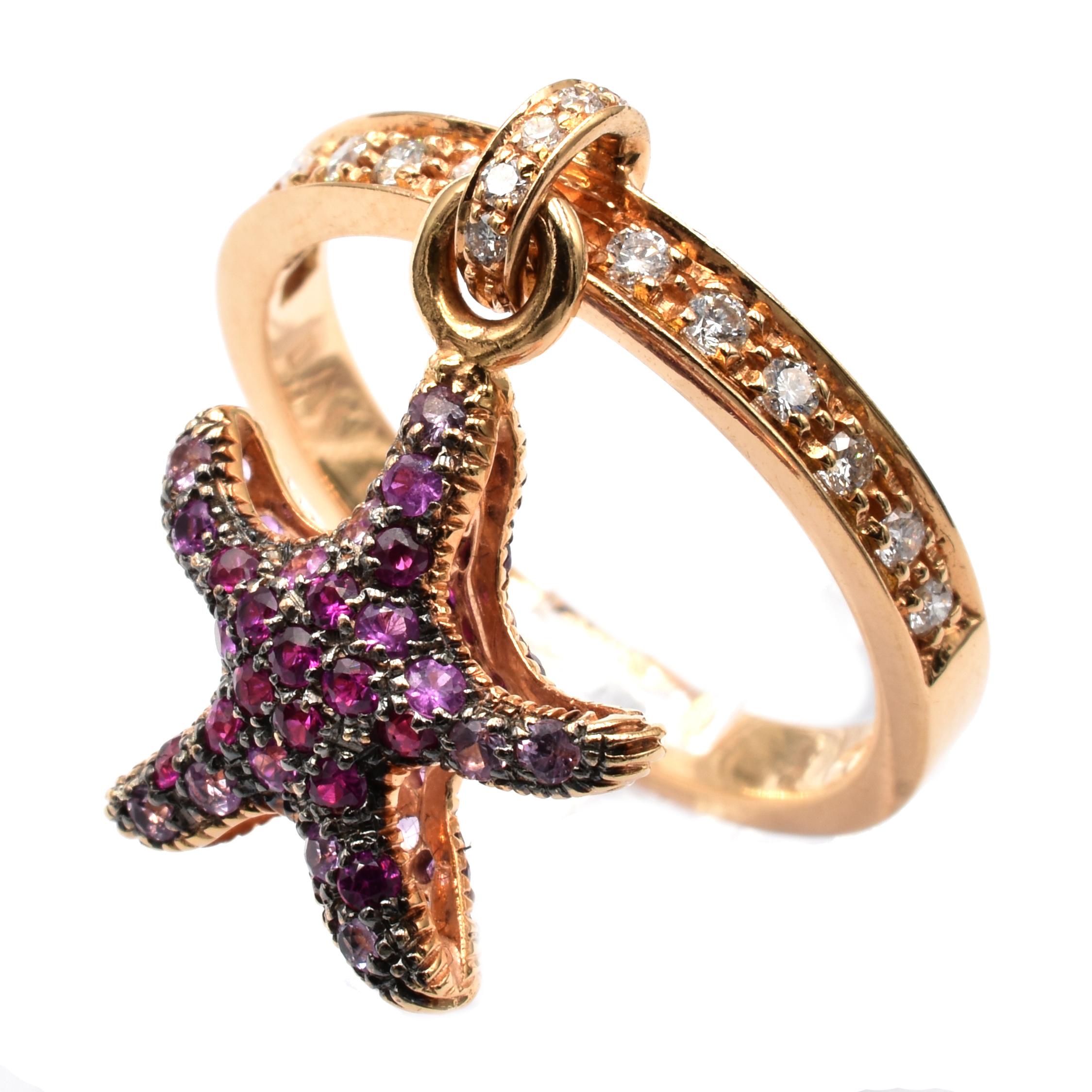 Gilberto Cassola 18Kt Rose Gold Ring with Pendant Starfish Charm. This Charm is set in both sides with Rubies on Black Rhodium Gold and hangs freely on the ring.
A very Funny and Happy Piece that perfectly match with a Wedding Ring for an everyday