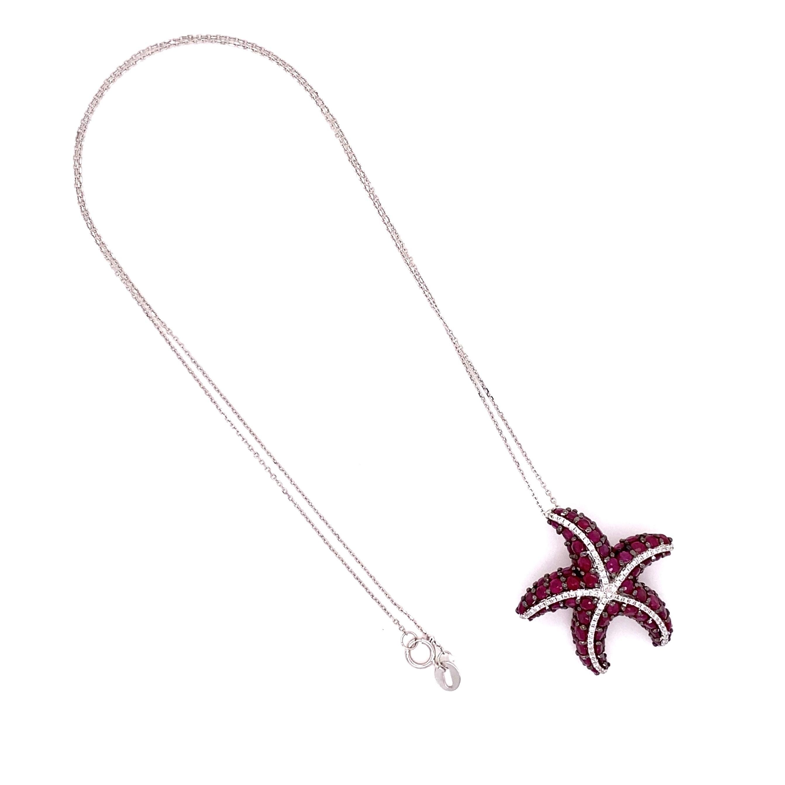 Beautiful Pendant Necklace featuring a Ruby and Diamond Starfish design, approx. 4.54tcw inter-spaced with Diamonds, approx. 0.27tcw. Hand crafted in 18K White Gold. Suspended from an 18