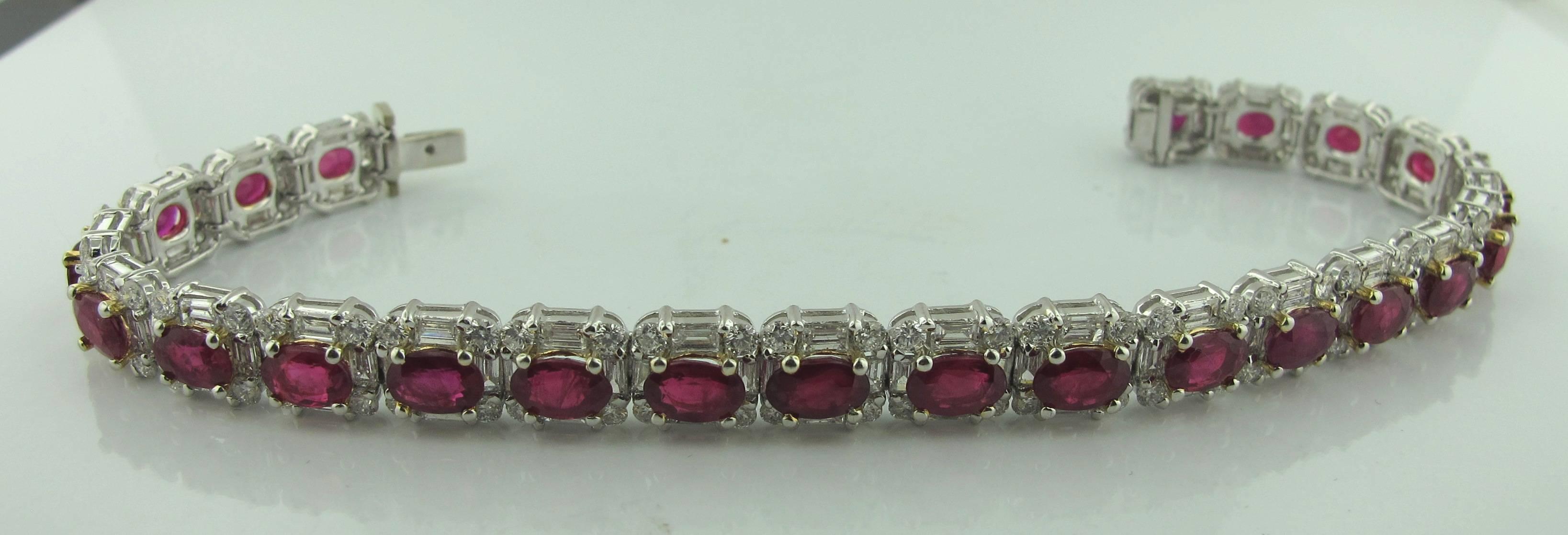 23 Oval Rubies down the center of this beautiful straight line bracelet, with a total weight of 15 carats.  There are 92 round brilliant cut diamonds and 92 baguette diamonds with a total diamond weight of 5.00 carats. G color, VS. 
