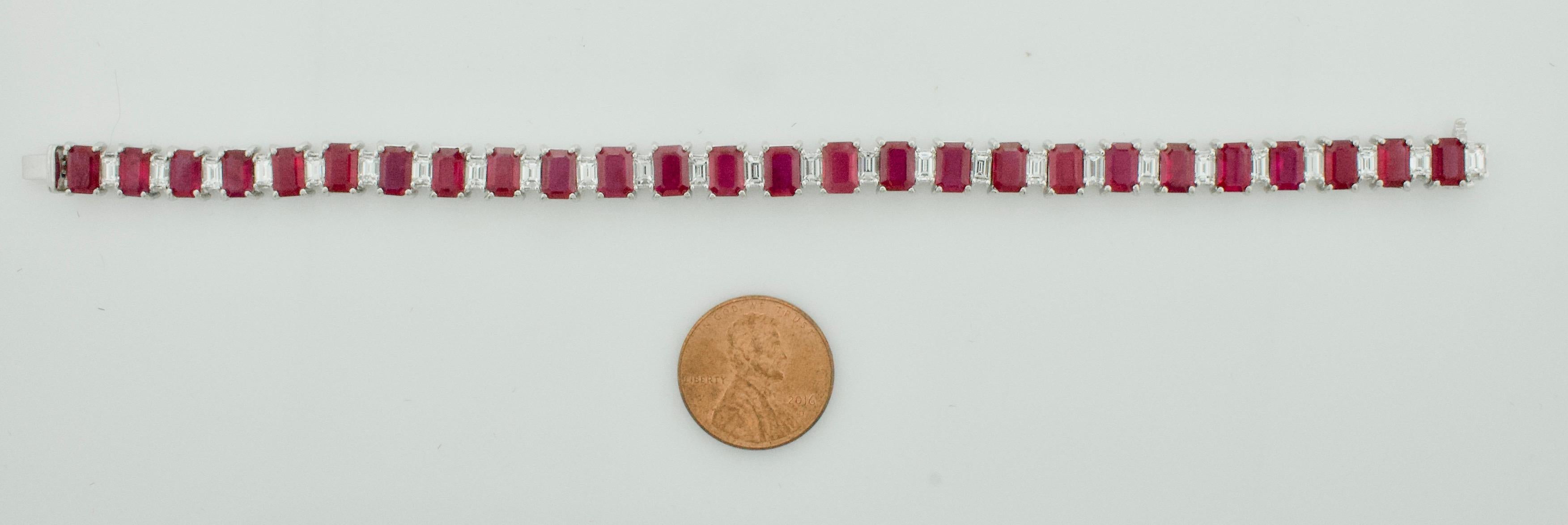 Ruby and Diamond Straight Line (Tennis) Bracelet in Platinum 
Twenty Six Emerald Cut Rubies weighing 15.20 carats [bright with no imperfections visible to the naked eye]
Twenty Seven Baguette Cut Diamonds weighing 2.76 carats [GHI VVS-VS2]

7 Inches