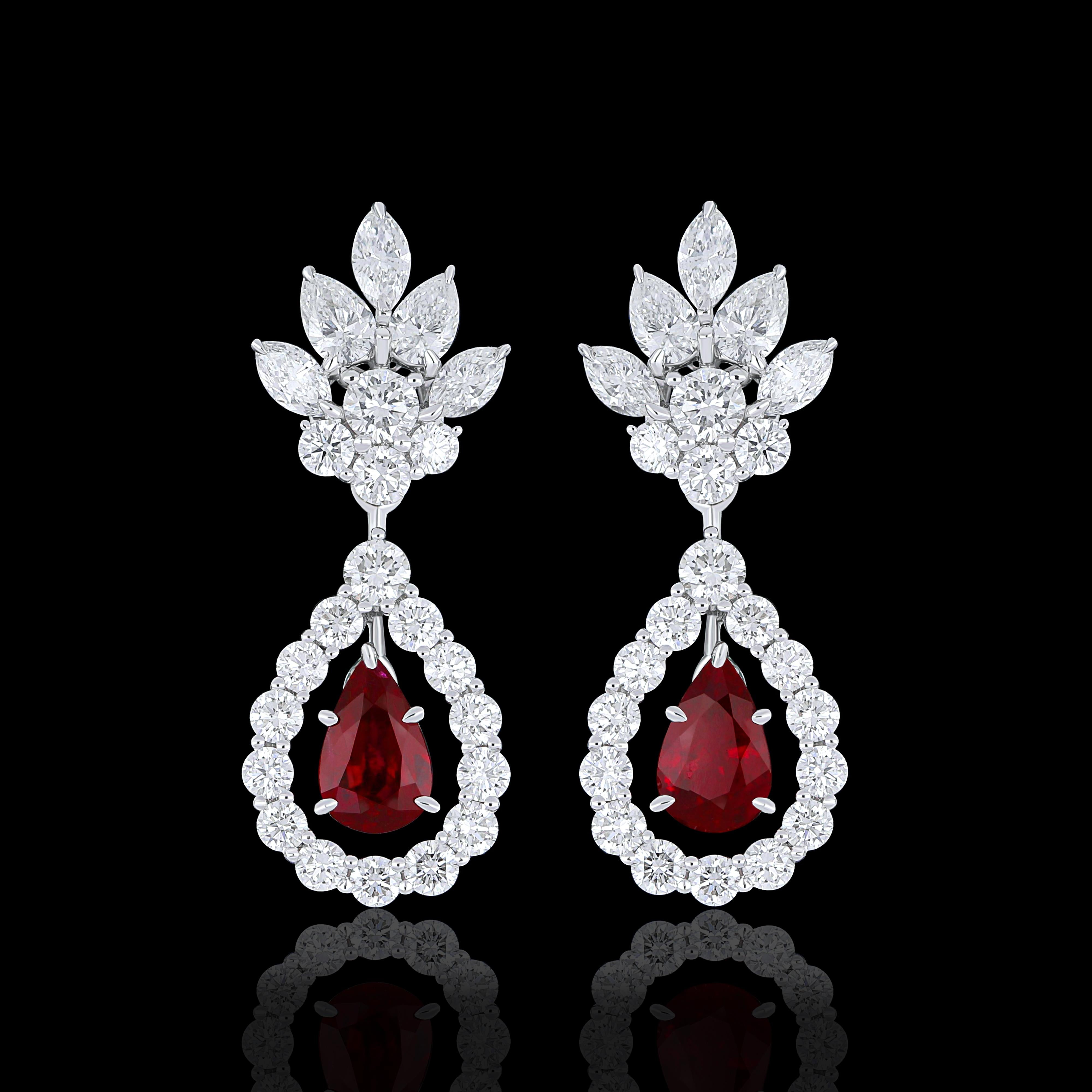 Elegant and exquisitely detailed 18 Karat White Gold Earring, center set with 0.78Cts .Pear Shape Ruby and micro pave set Diamonds, weighing approx. 1.53Cts Beautifully Hand crafted in 18 Karat White Gold.

Stone Detail:
Ruby: 6x4MM

Stone