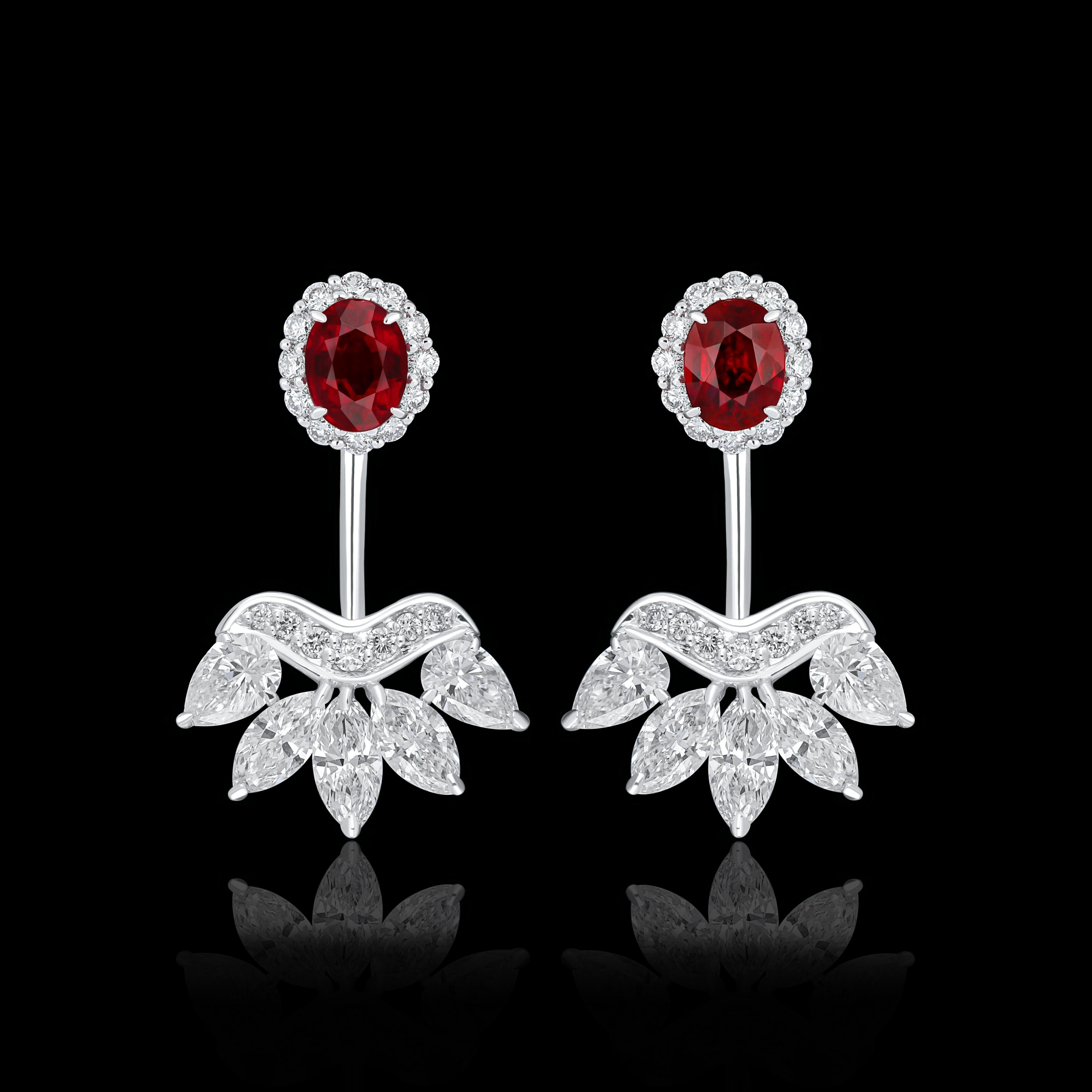 Elegant and exquisitely detailed 18 Karat White Gold Earring, center set with 0.77Cts .Oval Shape Ruby Mozambique and micro pave set Diamonds, weighing approx. 1.17Cts Beautifully Hand crafted in 18 Karat White Gold.

Stone Detail:
Ruby Mozambique: