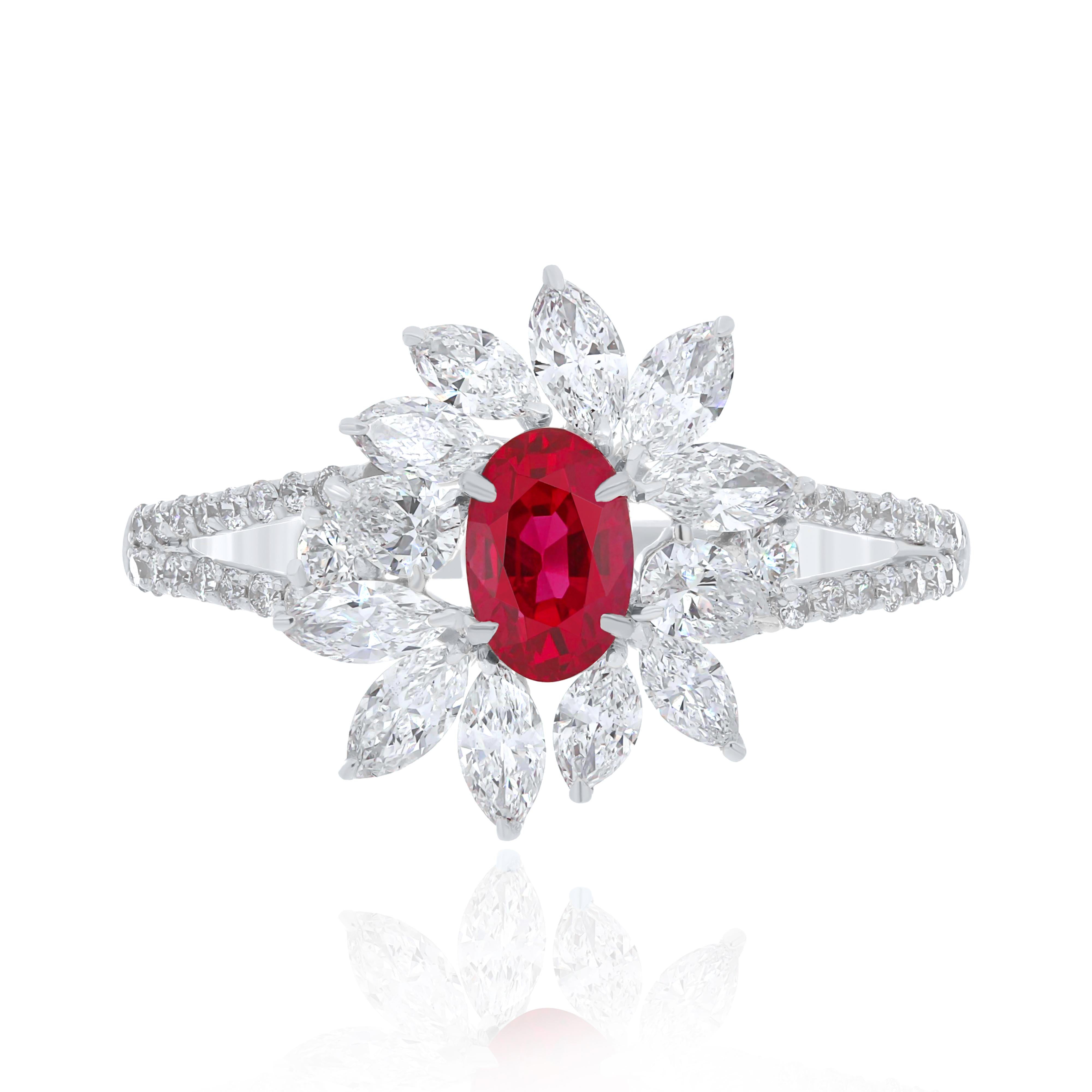 Elegant and exquisitely detailed 18 Karat White Gold Ring, center set with 0.92Cts .Oval Shape Ruby and micro pave set Diamonds, weighing approx. 0.98Cts Beautifully Hand crafted in 18 Karat White Gold.

Stone Detail:
Ruby Burma: 6x4MM

Stone