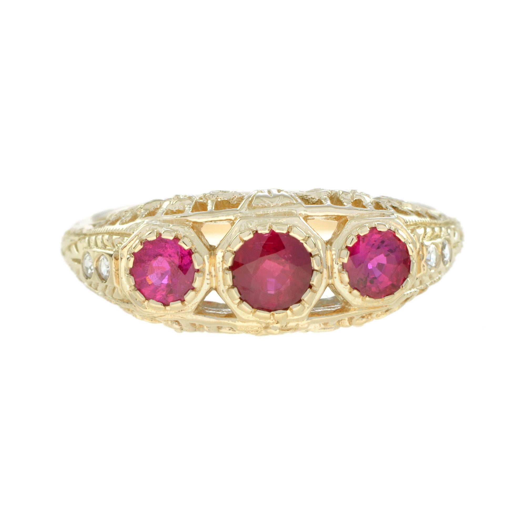 This stunning three stone filigree ruby Edwardian engagement ring in 14k yellow gold showcases a beautiful natural round rubies of 0.79 carat. The detailed vintage style filigree openwork design is finely decorated with millgrain edging. The outside