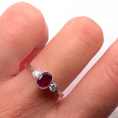 Ruby and diamond trilogy engagement ring antique style white gold