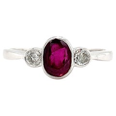 Ruby and diamond trilogy engagement ring antique style white gold