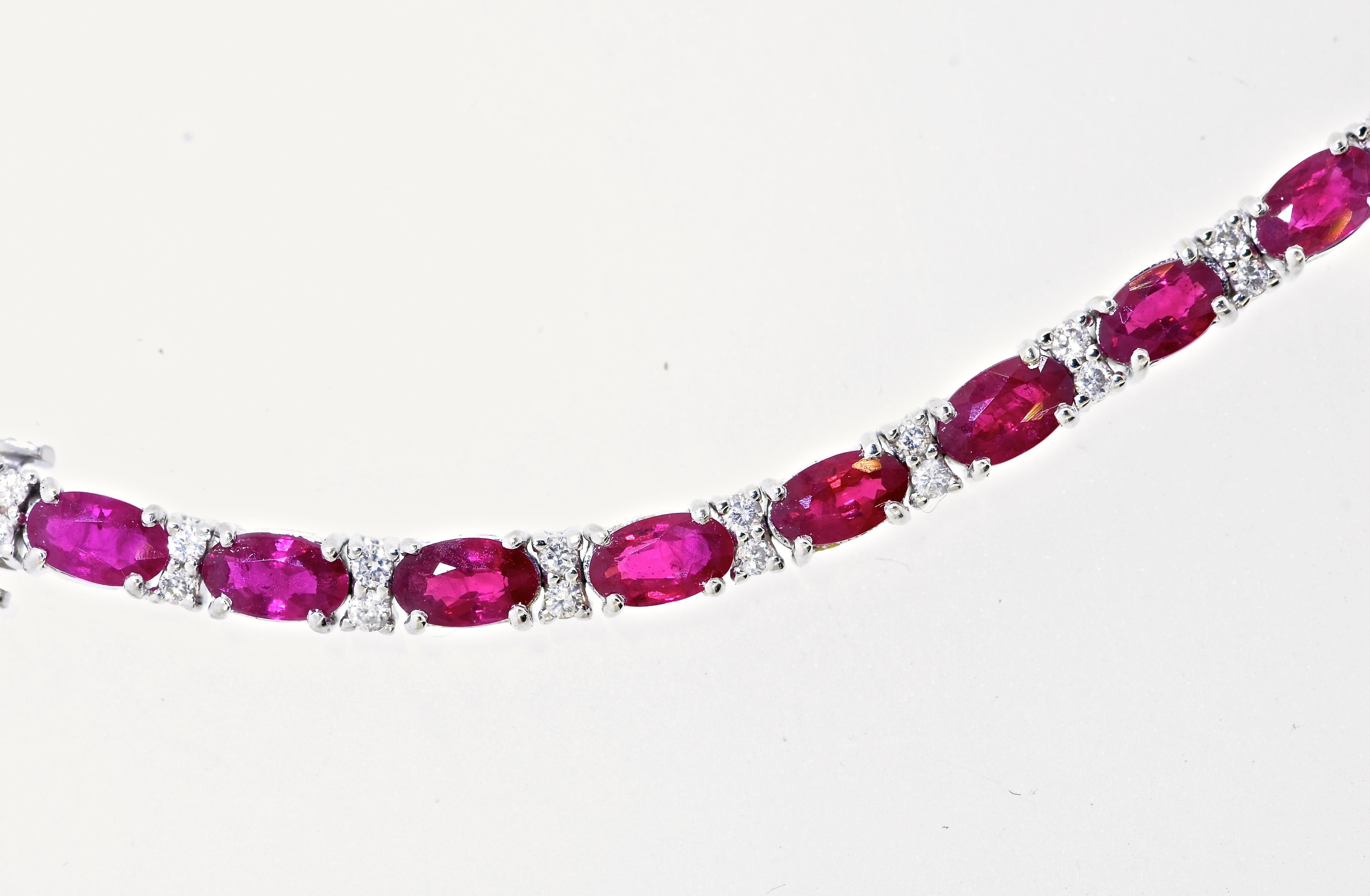 Diamond and ruby bracelet with fine stones.  The 26 natural vivid red rubies are well cut and well matched, very slightly included, and weigh an estimated 4.50 cts.  The 52 brilliant cut diamonds are near colorless (H) and very slightly included