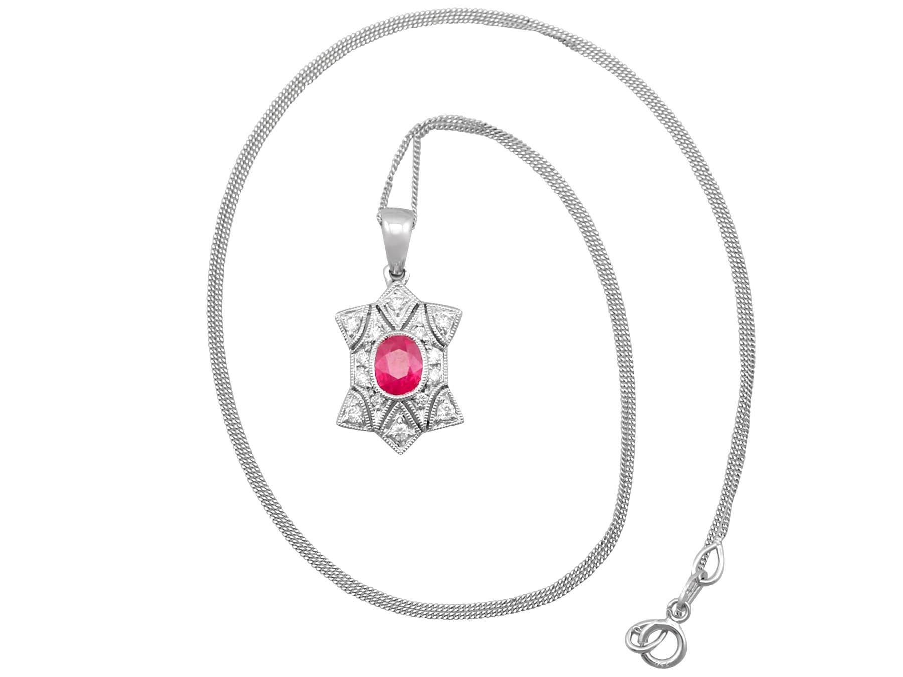 A fine and impressive contemporary 0.78 carat ruby and 0.28 carat diamond, 18 karat white gold pendant; part of our diverse contemporary jewelry collection.

This impressive contemporary ruby and diamond pendant has been crafted in 18 karat white