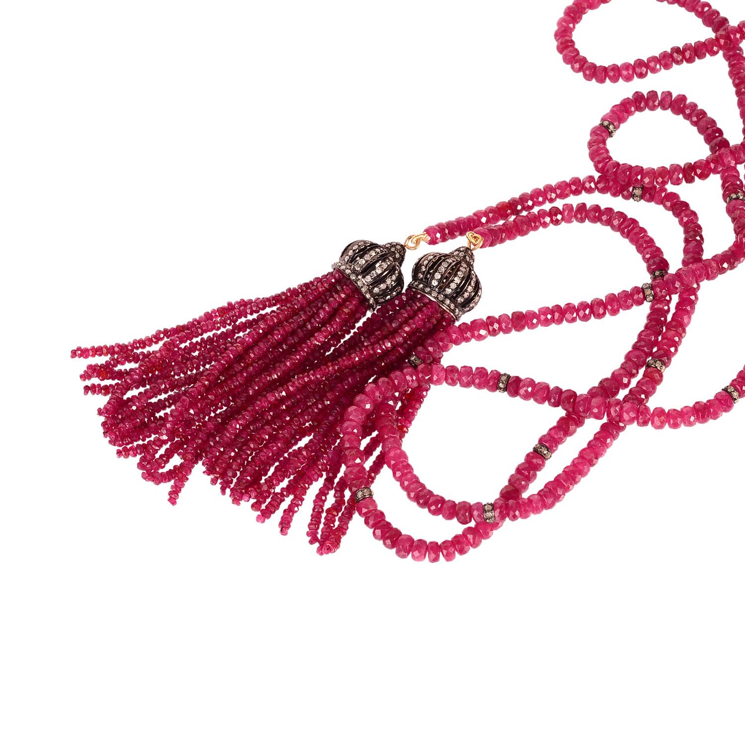 This lovely and charming beaded ruby wrap around necklace with ruby bead tassels with diamond top in silver is a designer piece and you can play with to wear in different ways.

18KT:s0.760gms
Diamond: 3.70ct
SI:s9.180gms
RUBY:s417.70cts
