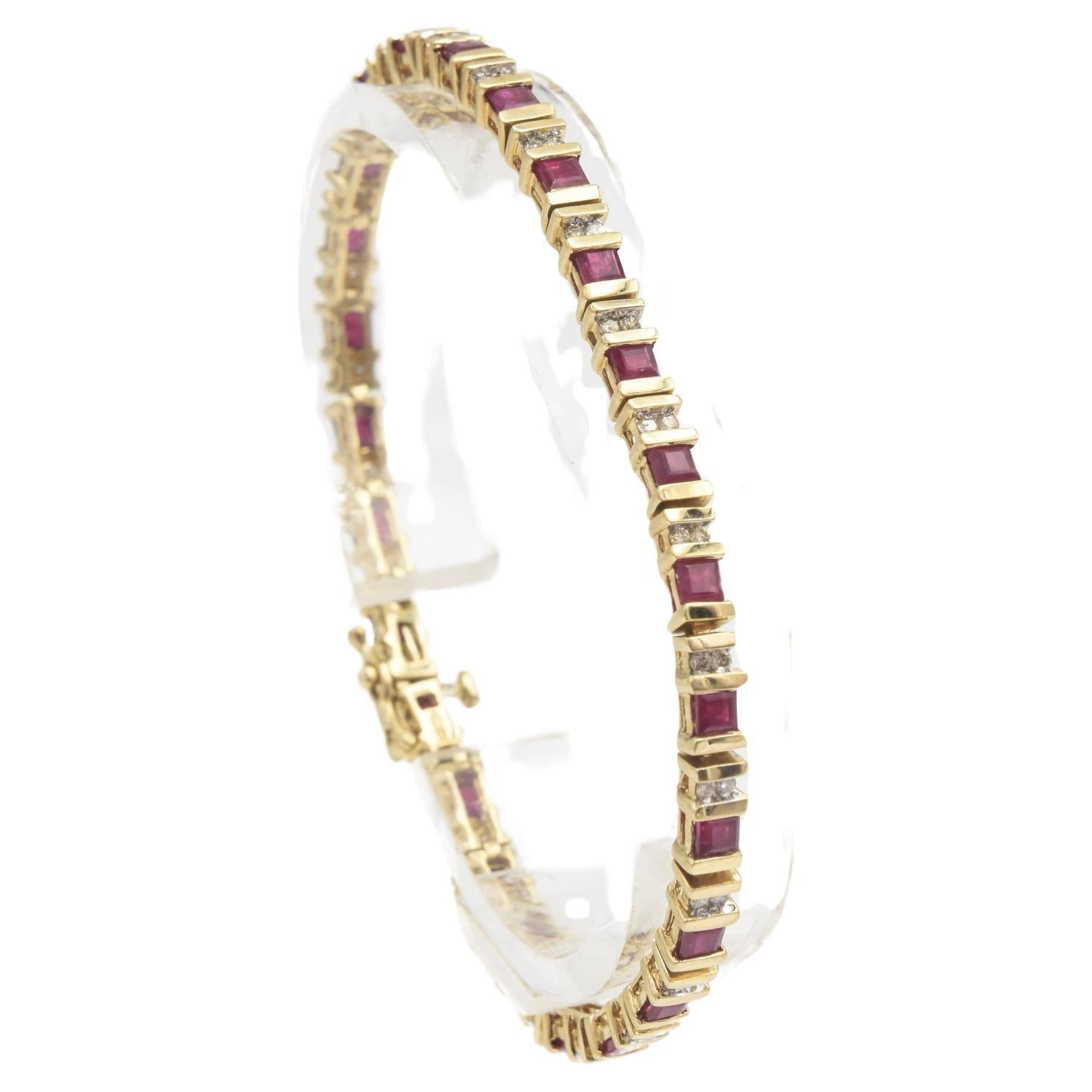 Ruby and diamond tennis bracelet featuring princess cut rubies set between 2 gold bars with a pair of diamonds between each link mounted in 14k yellow gold with push button clasp and figure eight clasp.
