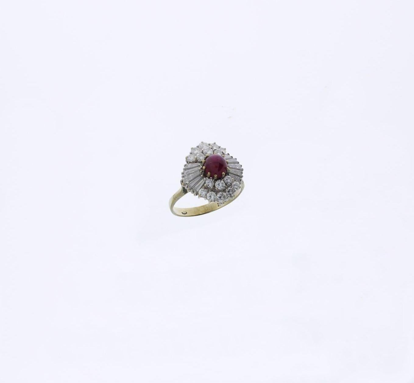 Pavé set with cabochon-cut ruby weighing approximately 1,0 ct., 10 baguette-cut diamonds weighing total ca. 1,10 ct. 
and 16 brilliant-cut diamonds with a total weight of ca. 0,66 ct. Mounted in 18 carat white- and yellow gold. 
Hallmarked with the