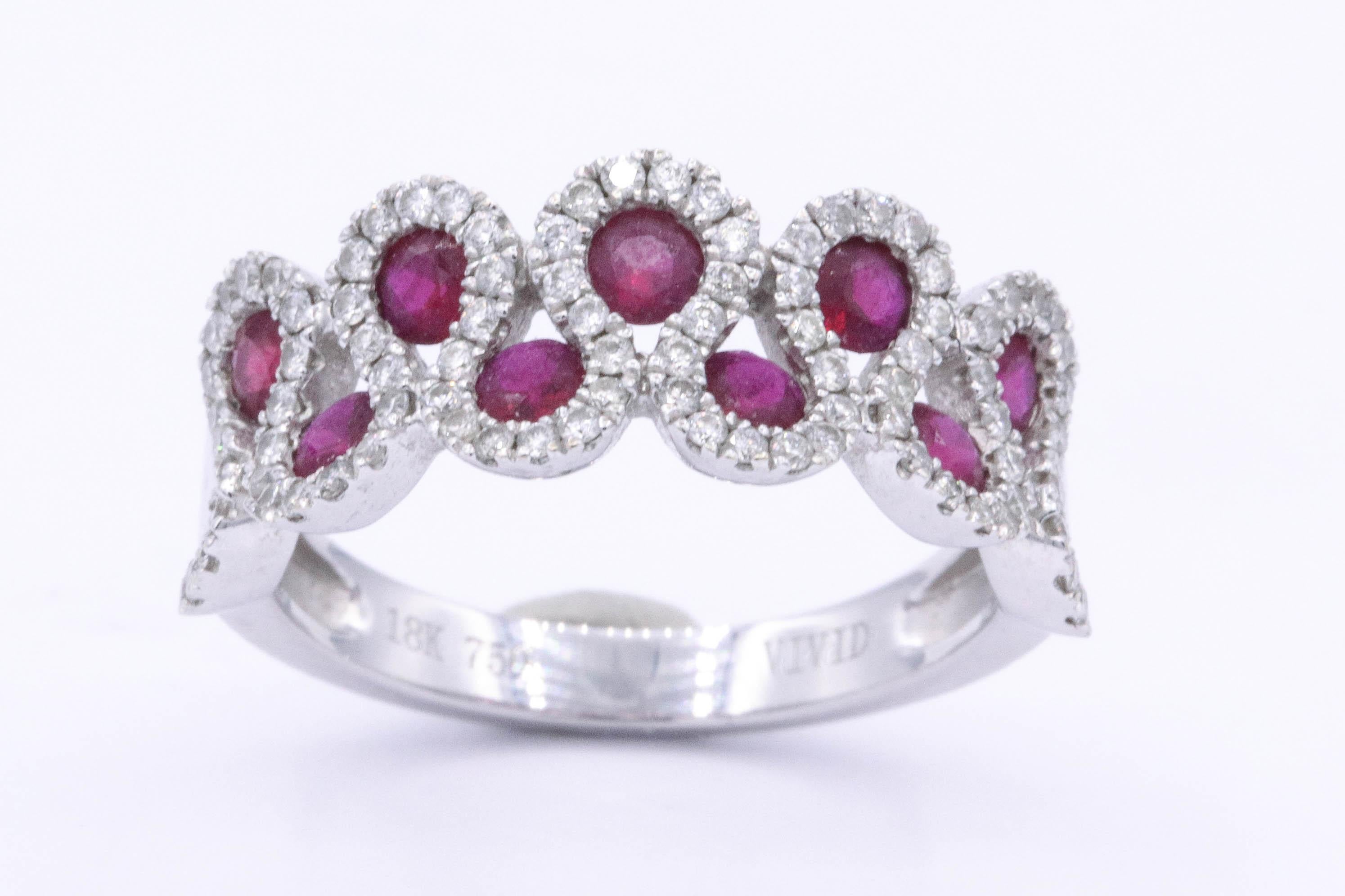 18K White Gold 
9 Ruby's 0.77 cts.
90 round diamonds 0.44 cts.