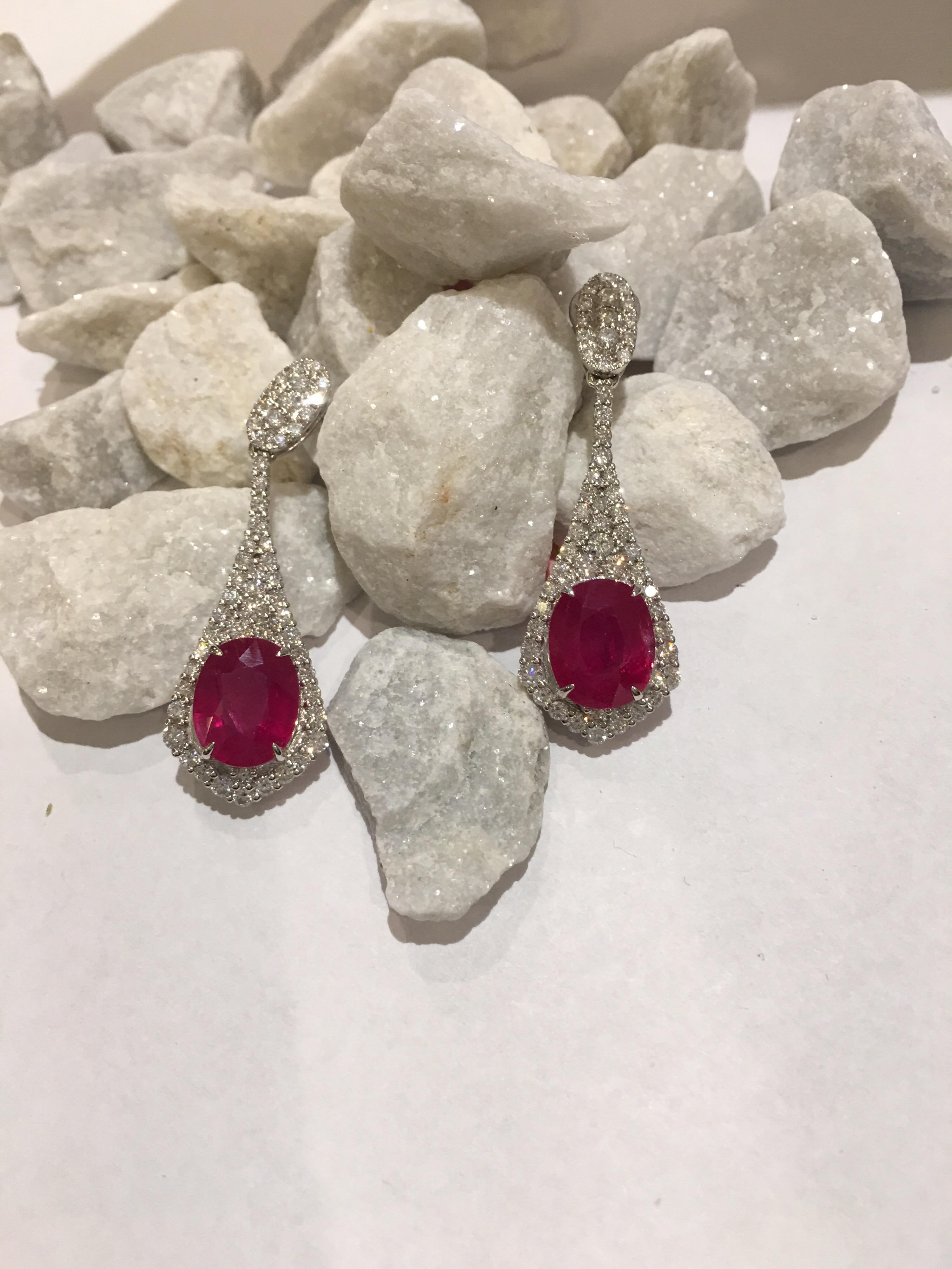 Natural unheated, Untreated, Not Dyed, Oval Ruby 7.41 Carat on both set with 1,51 Carat White Diamonds Set in 18K White Gold.
This is one of a Kind Handcrafted Earrings is Push back with post .