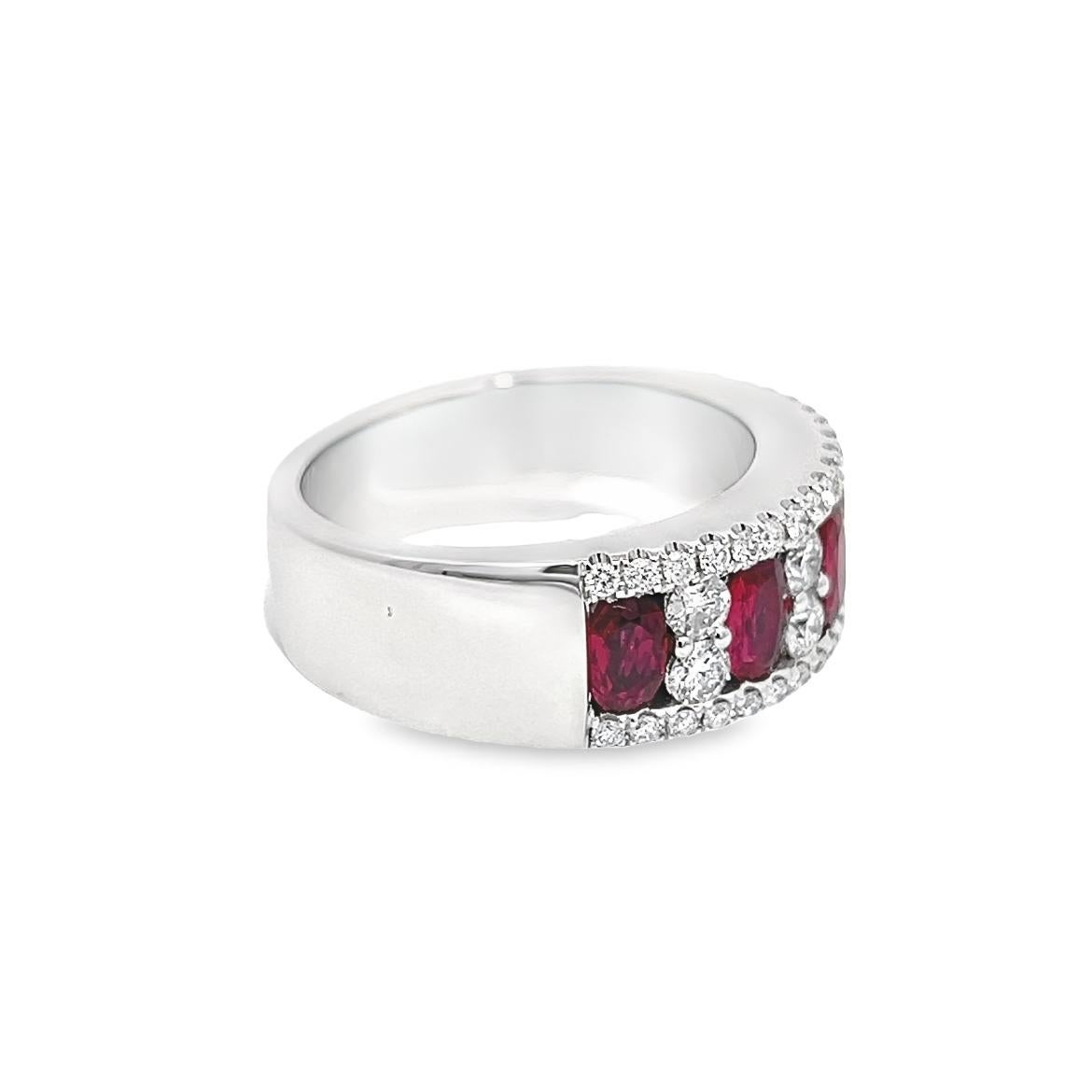A captivating and colorful quintet of richly saturated, oval shaped vibrant raspberry-red rubies, together weighing 1.27 carat weight total, are interspersed by bright white and sparkling round cut diamonds, in this Victorian inspired band ring hand