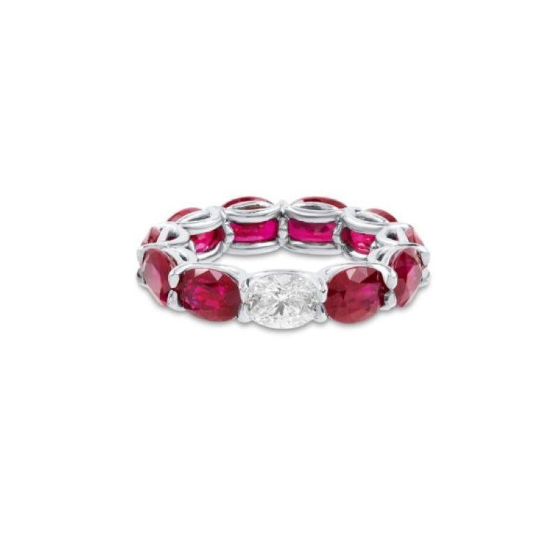 This beautiful Ring features 9 Fine Oval Shaped Rubies weighing 9.76 Carats with 1 Oval Diamond weighing 0.71 Carat that can be worn Diamond side up or down. Set in Platinum. Each Ruby is over 1.0 Carat.
Finger Size 5.