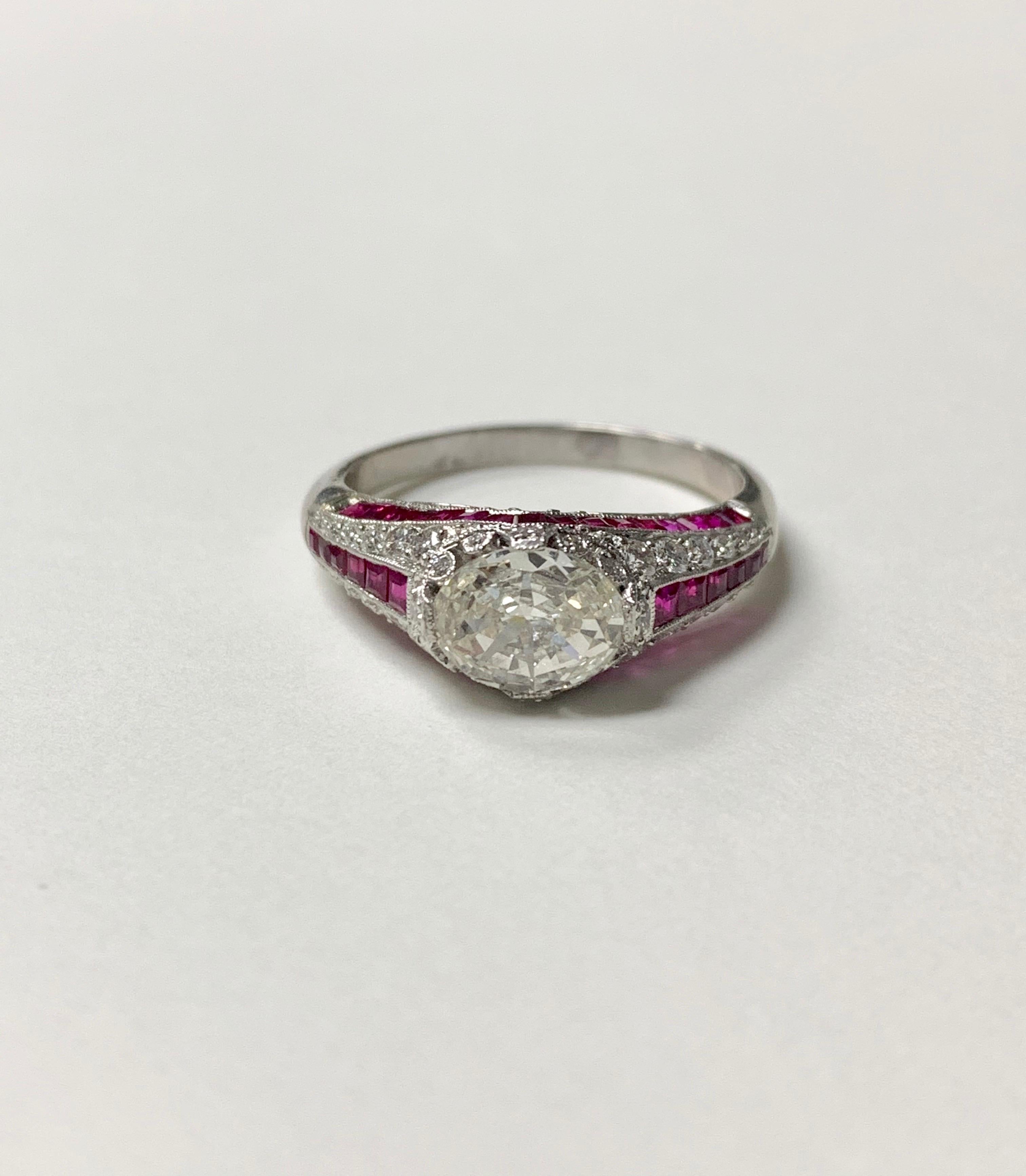 Unique white oval step cut diamond and ruby diamond ring in platinum.
The details are as follows : 
Oval diamond weight : 1.35 carat ( JK color and VS 1 clarity ) 
Small diamond weight : 0.45 carat 
Ruby weight : 0.65 carat 
Metal : Platinum 
Ring