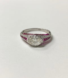 Ruby and Oval Step Cut Diamond Engagement Ring in Platinum