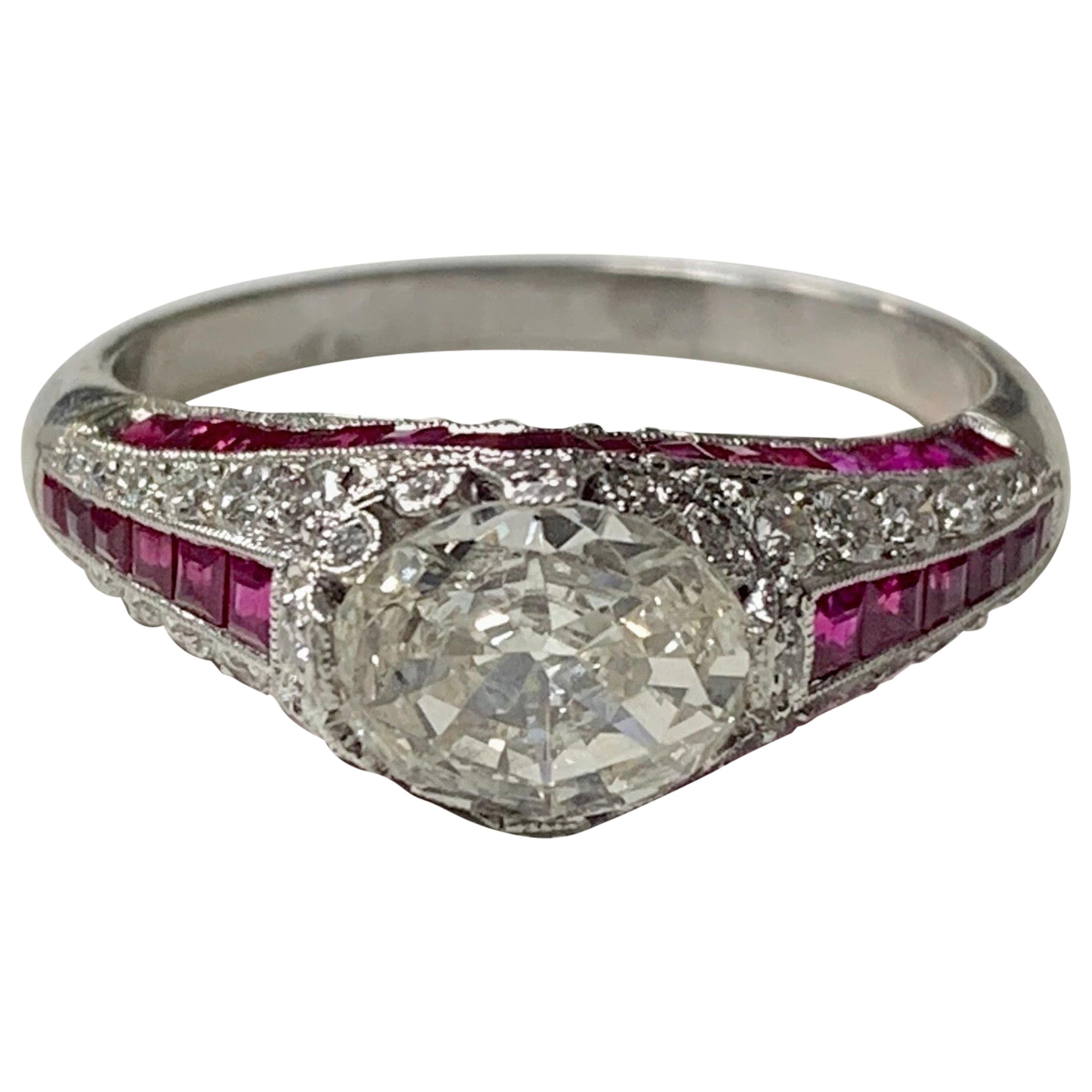 Verlobungsring mit Rubin und ovalem Diamant im Stufenschliff aus Platin