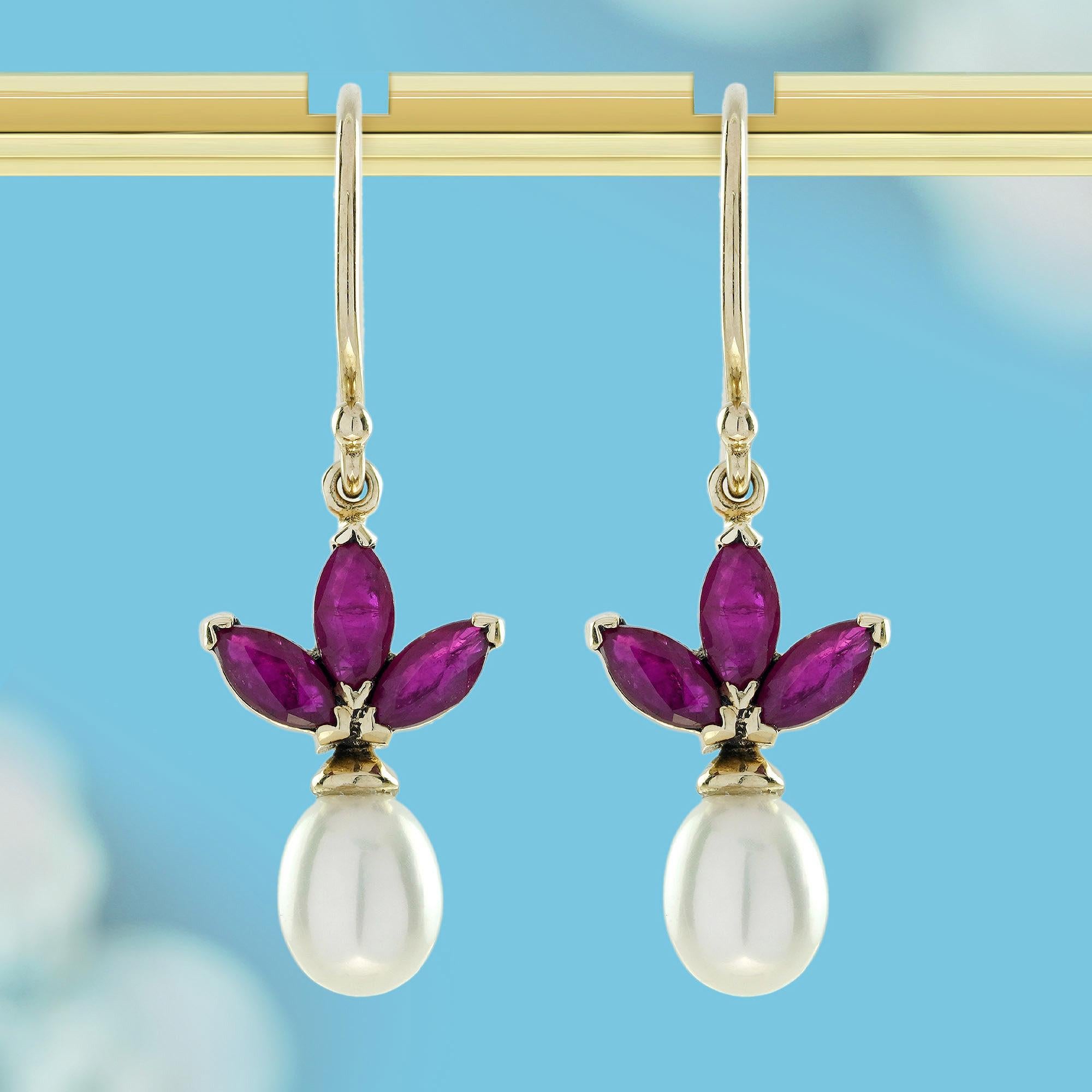 A stunning blend of classic elegance and timeless beauty, these earrings feature rubies that resemble a floral design, capturing the essence of passion and love. Their deep red hue symbolizes strength and vitality. The soft, lustrous pearl, in a