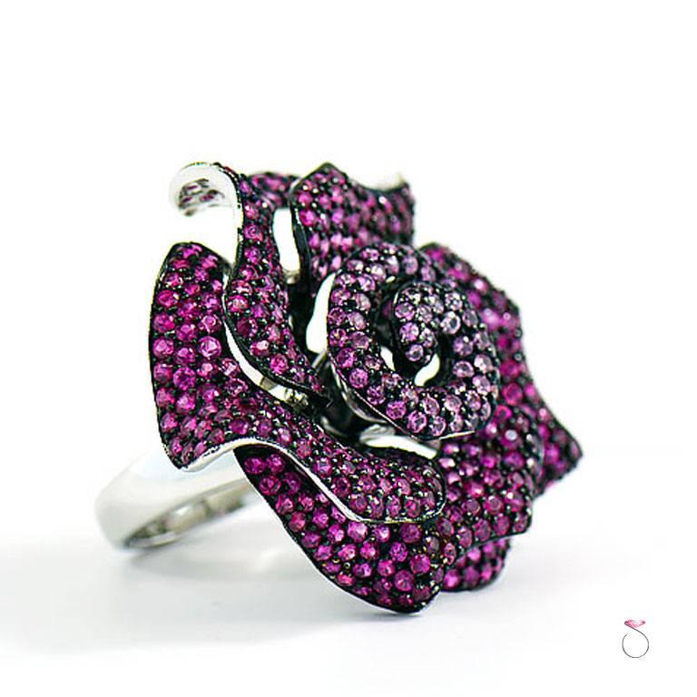 Ruby & Pink Sapphire Rose ring is such a gorgeous piece of jewelry worthy of the Red Carpet. This magnificent ring features 335 round brilliant cut Rubies that average 0.03 ct. in size each for an approximate total carat weight of 10.05 ct. The