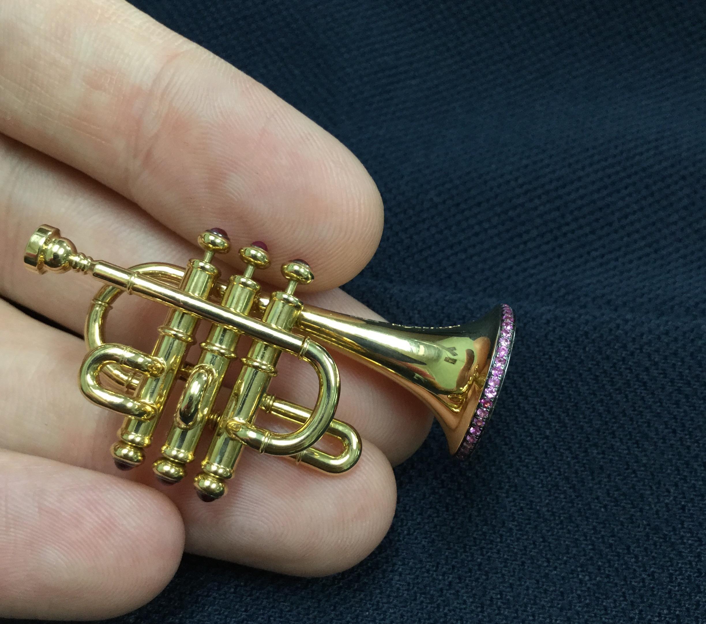 Mousson Atelier represent with prouds!
18 Karat Gold Brooch from our Musical Instruments Collection, Ruby and Pink Sapphires. The buttons are movable. And the music notes fling out, makes this brooch alive.

45mm x 27mm x 18mm
18.13 gms