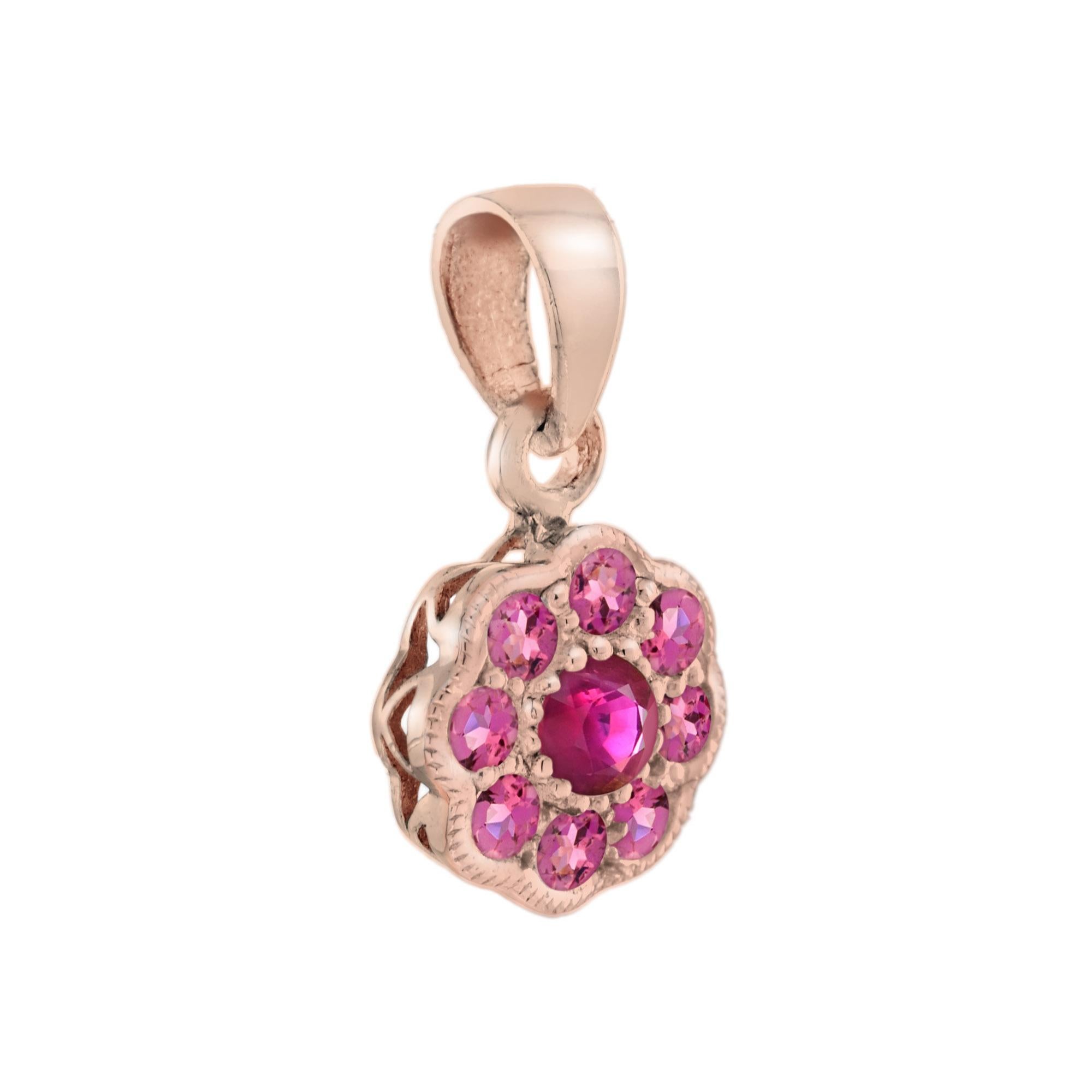 A stunning and beautiful design of the iconic Edwardian style flower cluster pendant, featuring round ruby for its center and eight round cut striking pink tourmaline beautifully set into 14k rose gold.

Ring Information
Style: Edwardian
Metal: 14K