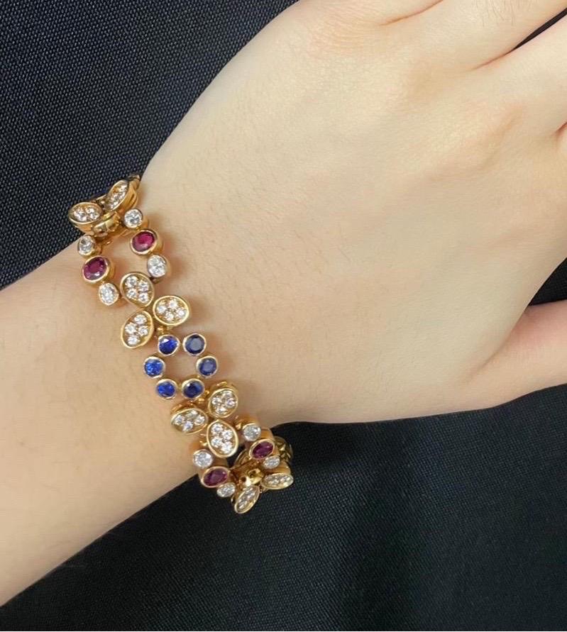 Ruby and Sapphire Floral Bracelet

A bracelet featuring a combination of diamonds, rubies, and sapphires set in a floral motif. 

112 diamonds weighing approximately 5.94 carats 
8 rubies weighing approximately 3.56 carats
24 sapphires weighing