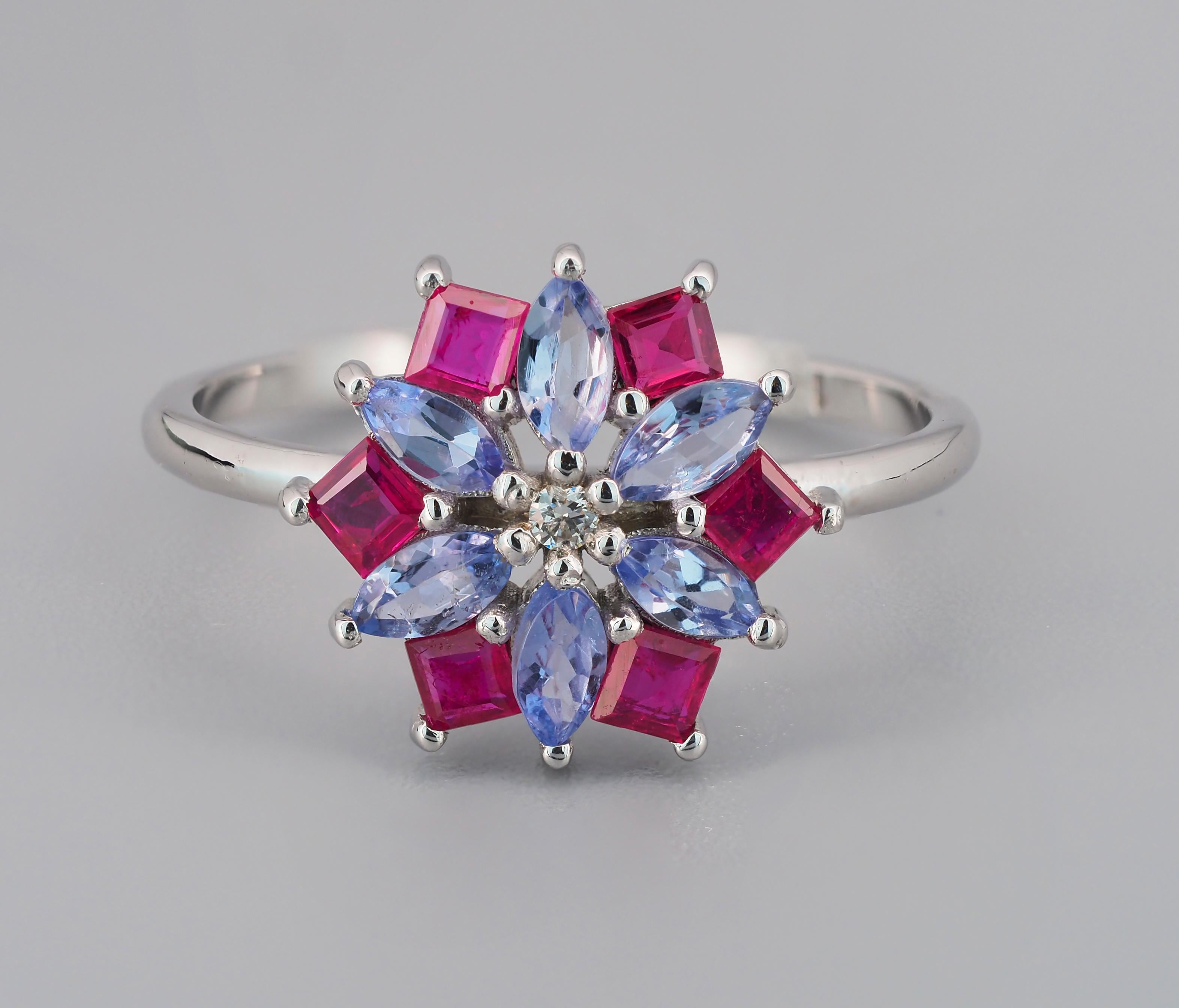 Ruby and tanzanite 14k gold ring. 
Flower gold ring with tanzanites. Elegant gold ring with tanzanites, rubies. Colorfull ring. Elegant ring.

Metal:14k gold
Weight: 2.2 g. depends from size.

Central stones: Tanzanites
Cut: Marquise
Weight: aprx