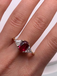 Ruby and trillion diamond trilogy engagement ring 18k yellow gold
