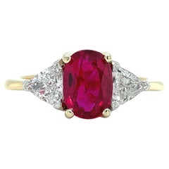 Ruby and trillion diamond trilogy engagement ring 18k yellow gold