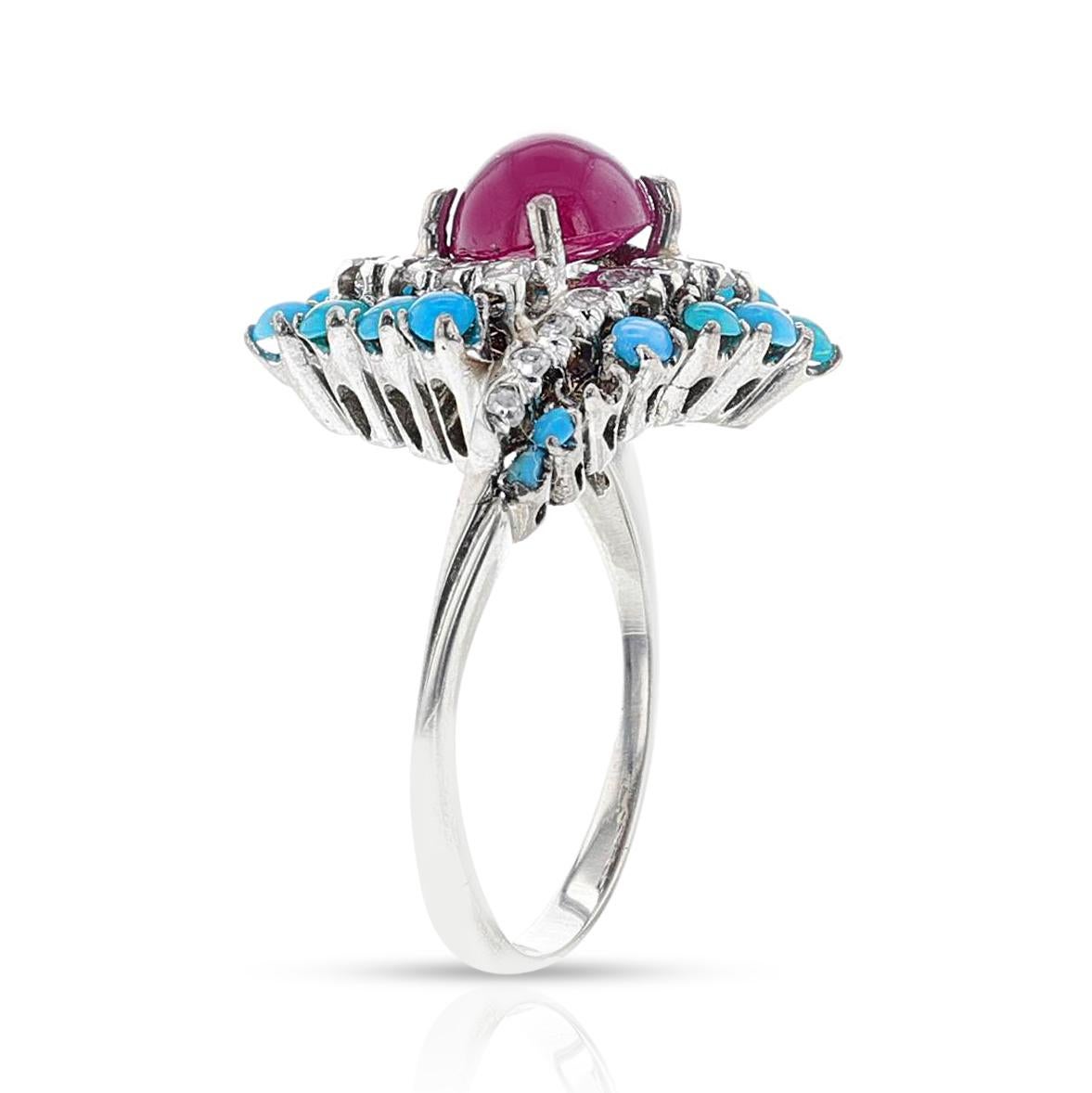 Ein Rubin und Türkis Cabochon Ring mit Diamanten in 18k Weißgold. Der Rubin-Cabochon hat 1,25 Karat. Ring Größe 6.25 US. Gesamtgewicht 4.15 Gramm.