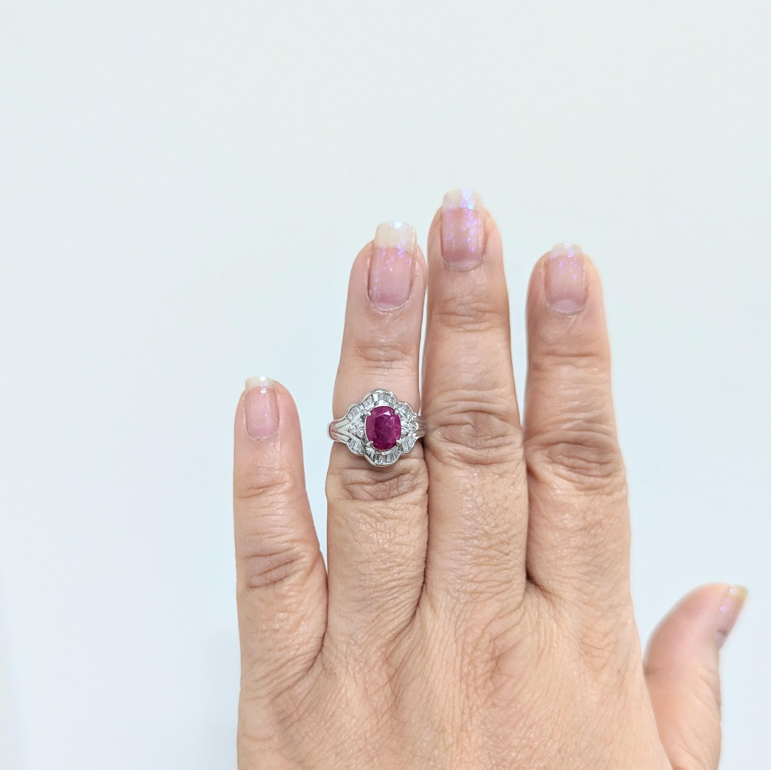 Beautiful 2.23 ct. ruby oval with 0.41 ct. good quality white diamond baguettes and rounds.  Handmade in platinum.  Ring size 5.25.