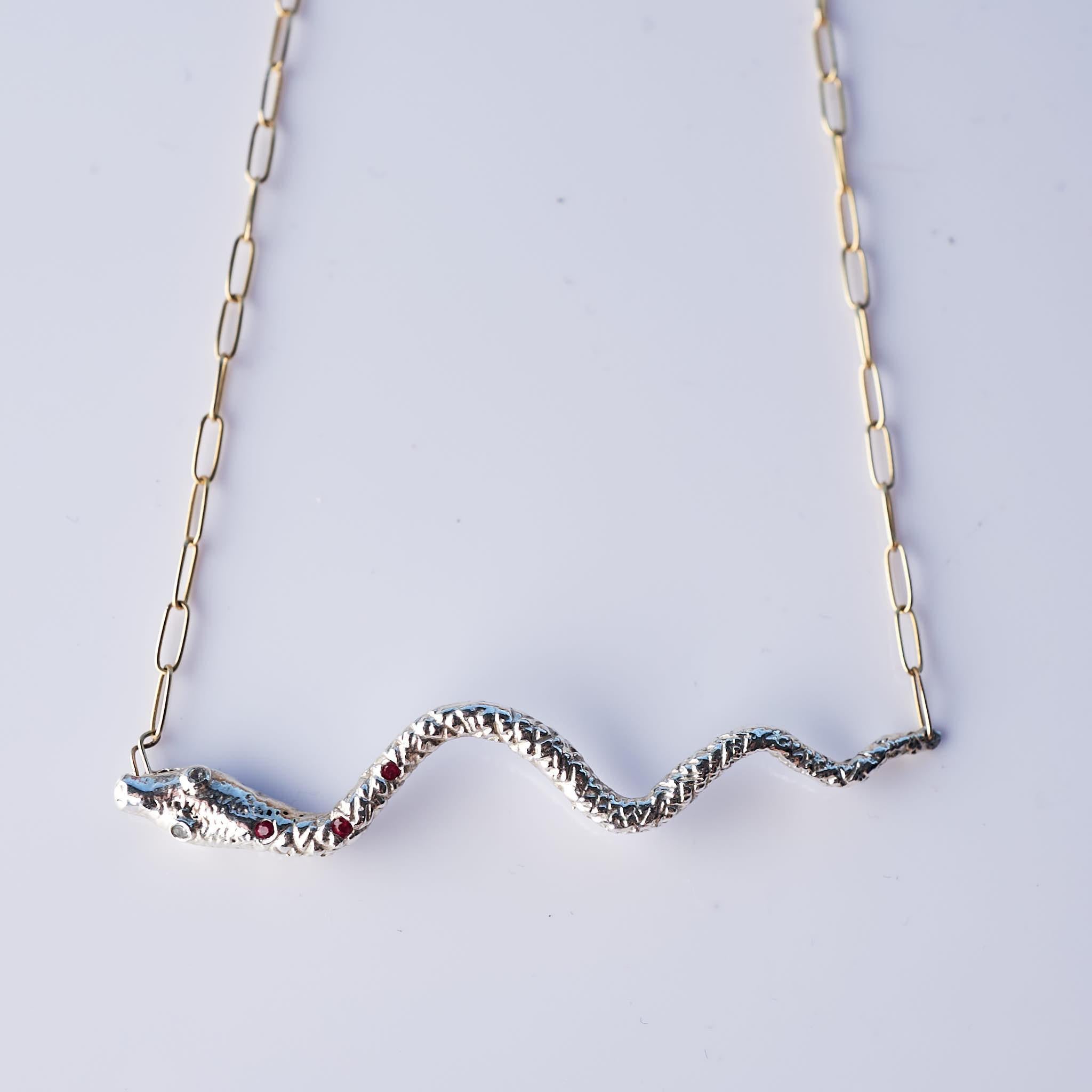 Ruby Aquamarine Snake Necklace Choker Chain Silver J Dauphin

Can be worn as a choker or linger - chain is adjustable - available as 20 inch but can be worn as in any size shorter.

J DAUPHIN Necklace with pendant snake in silver with yellow gold