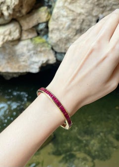 Bracelet en or 18K serti de rubis