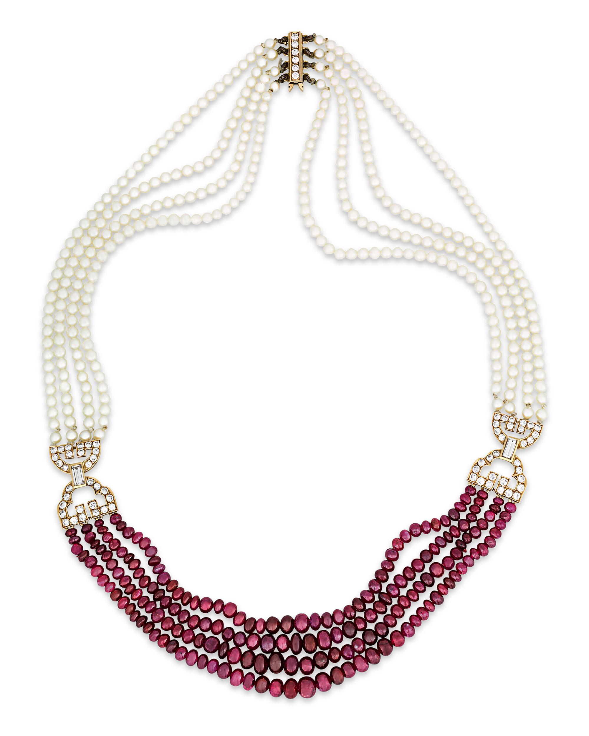 Four strands of crimson red ruby beads complement four strands of pearls in this luxurious designer necklace by Cartier. The necklace is secured by two 18K yellow gold clasps adorned by brilliant- and emerald-cut white diamonds totaling