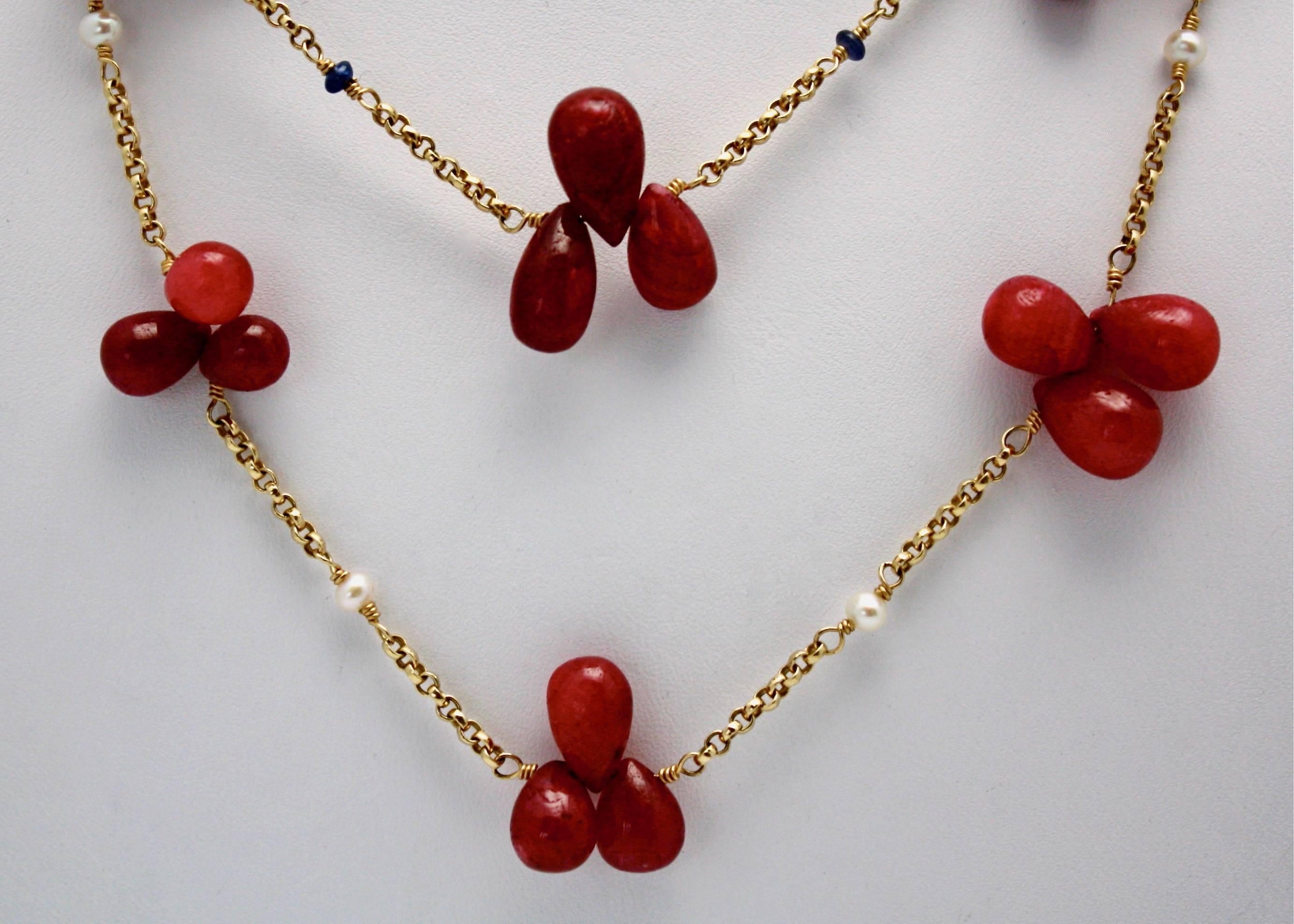 These teardrop Ruby beads are two necklaces put together,or worn individually.  One is set with Seed Pearls and the other with Sapphire beads. Each necklace is 17