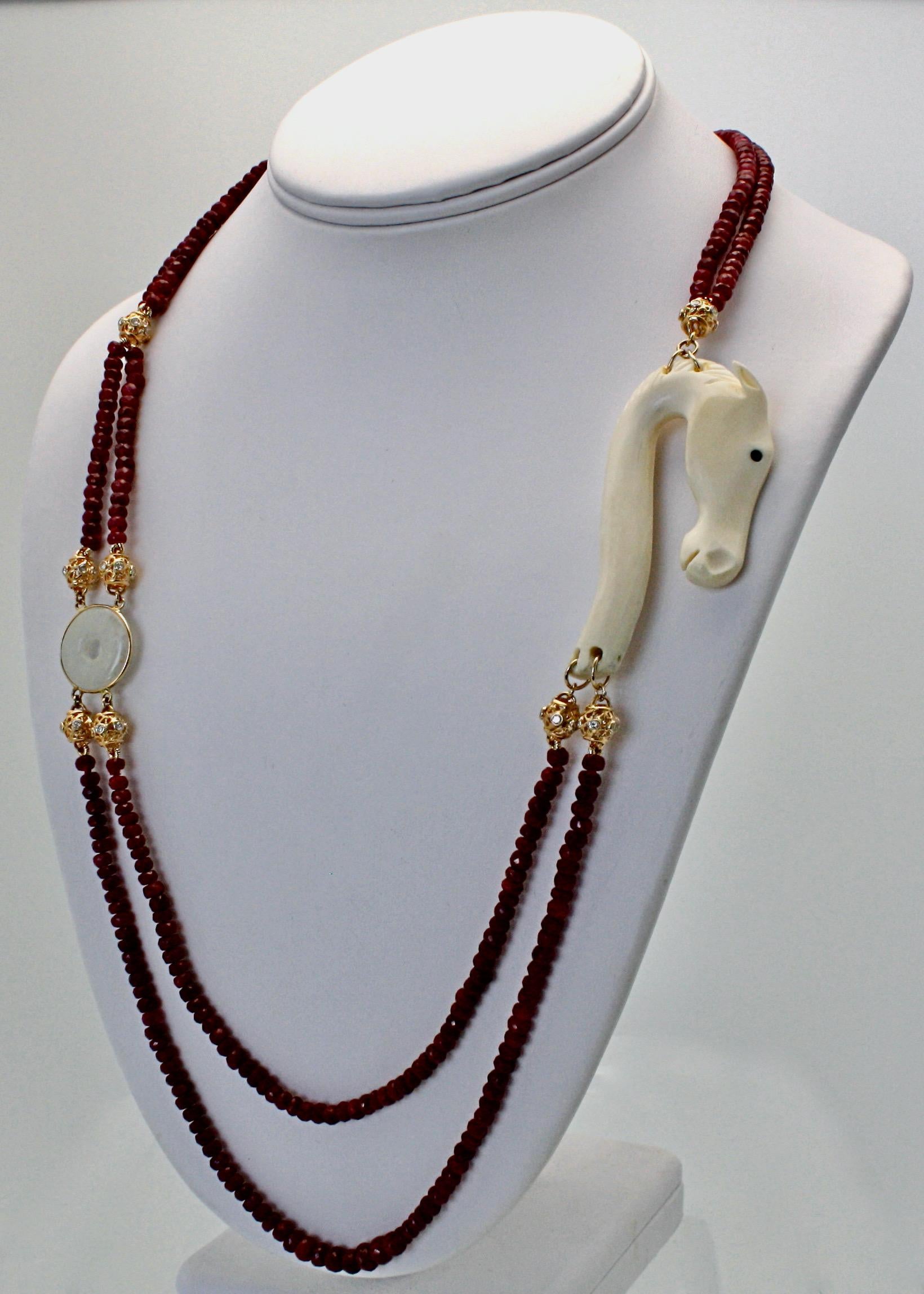 This gorgeous bead necklace is custom made and one of a kind.  It features faceted Ruby Beads The Ruby beads form a double strand necklace as there are  2 strands of Ruby Beads which graduate in the center and a single row in the back. This necklace