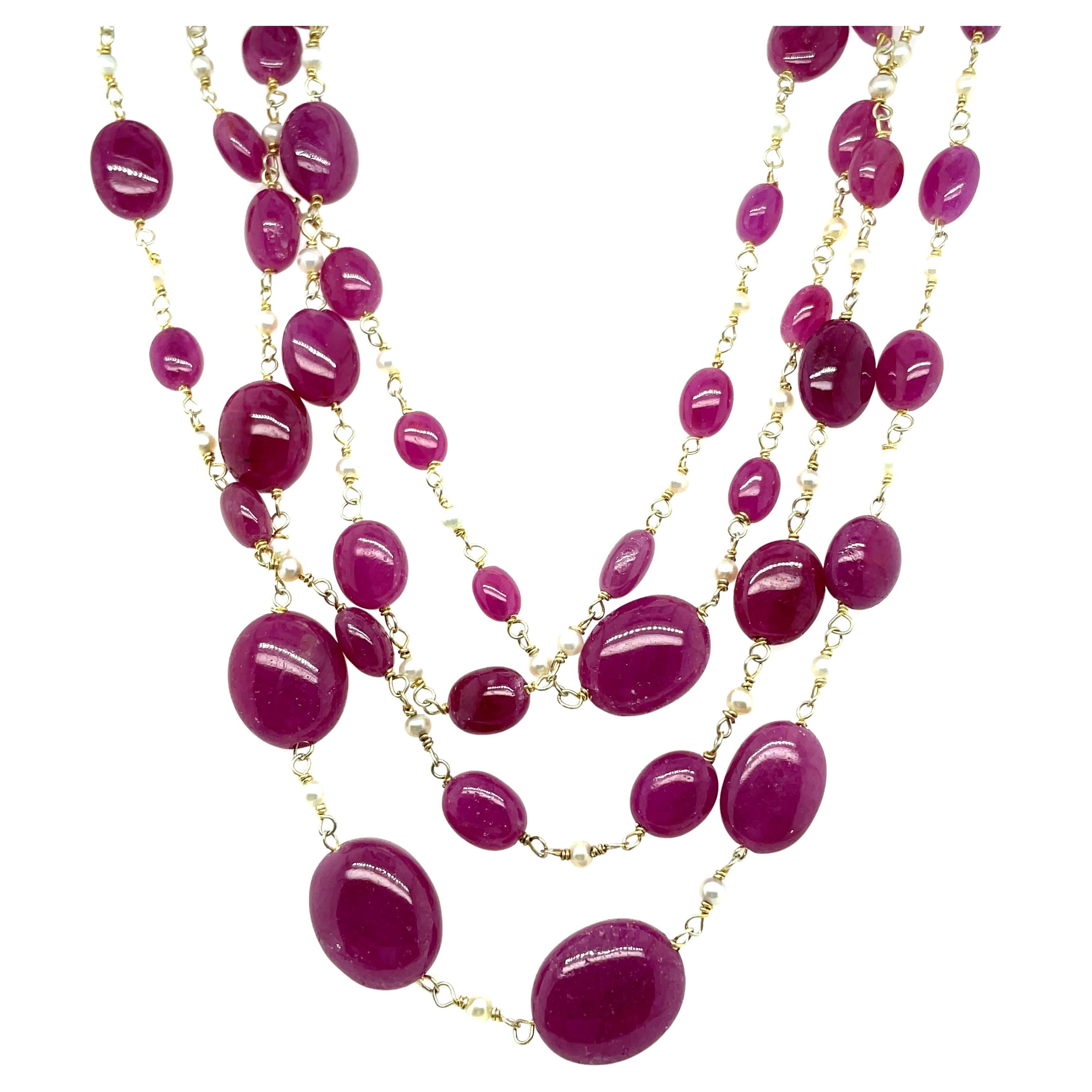 
Adorned with a stunning array of 325 carats of ruby beads, sourced from the renowned mines of Africa. 

Each piece is meticulously handcrafted and connected with gleaming gold knots.

Boasting a length of 78 inches, it elegantly drapes as a half