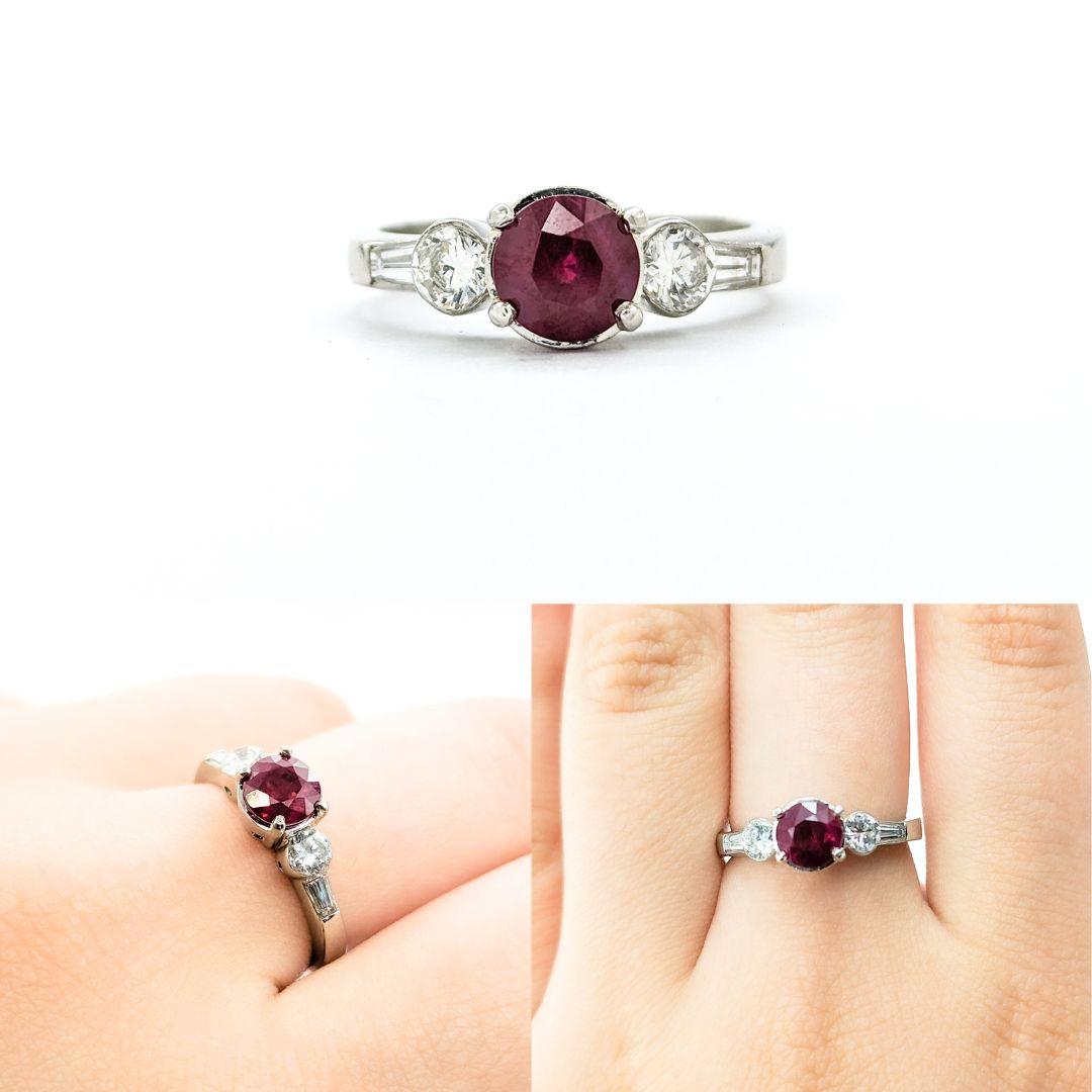 Ruby & Bezel Set Diamond Ring in Platinum

Introducing this beautiful ring crafted in 950pt platinum. The ring features a 1.27ct natural Ruby centerpiece and 0.64ctw round and baguette diamonds. The sparkly 0.64ctw diamonds are VS clarity and have a