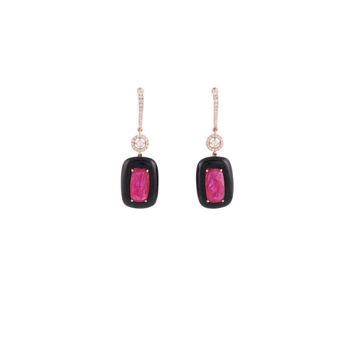 These are an exclusive designer earrings features 2 pieces of rose cut rubies weight 6.90 carat, set in a frame of black onyx weight 11.62 carat with round shaped diamonds weight 0.49 carat, these earrings are entirely made in 18k rose gold weight