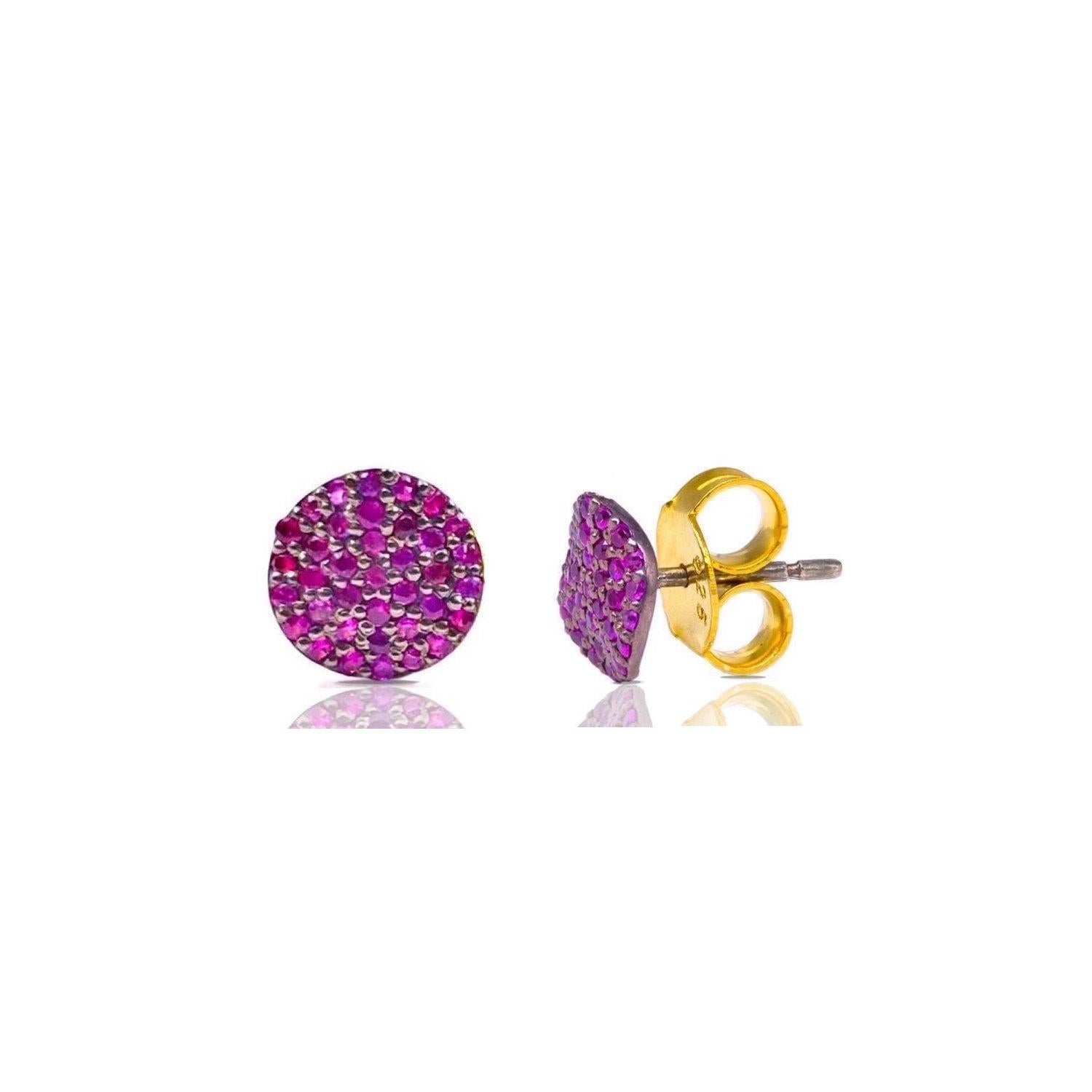 Fiery pink Rubies set into stylish stud earrings in a contemporary wave design of blackened silver with gold accents.

- Natural Pink Rubies weight approx .82 Carats.
- Set in Blackened Oxidized Silver with 22 Karat Gold accents.
- For pierced ears.