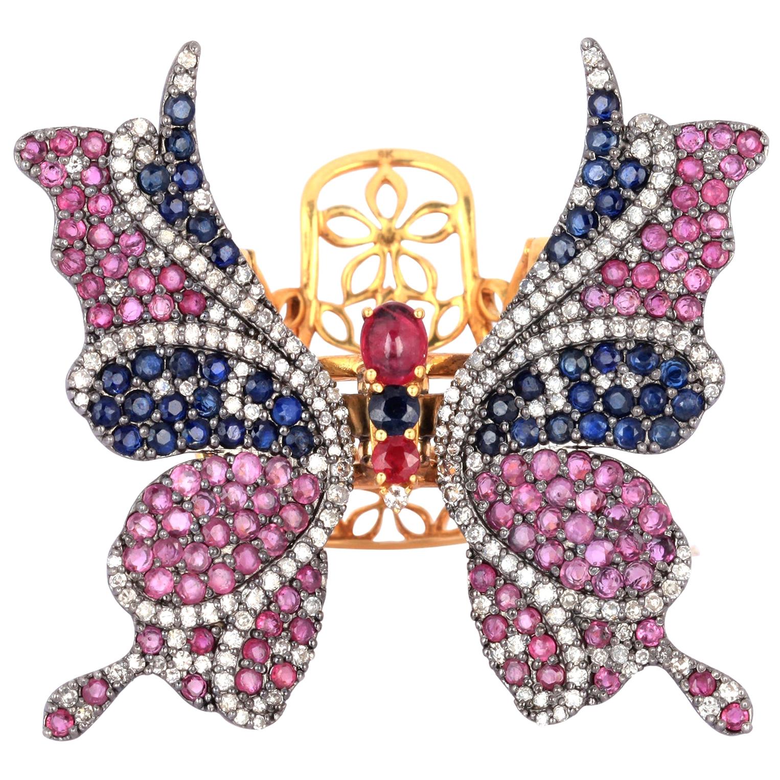 En vente :  Bague papillon en rubis, saphirs bleus et diamants