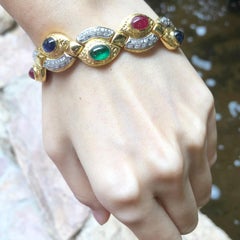 Bracelet de rubis, saphir bleu, émeraude et diamant en or 18 carats