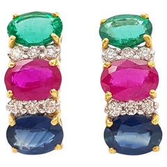 Boucles d'oreilles rubis, saphir bleu, émeraude et diamant sur monture en or 18 carats