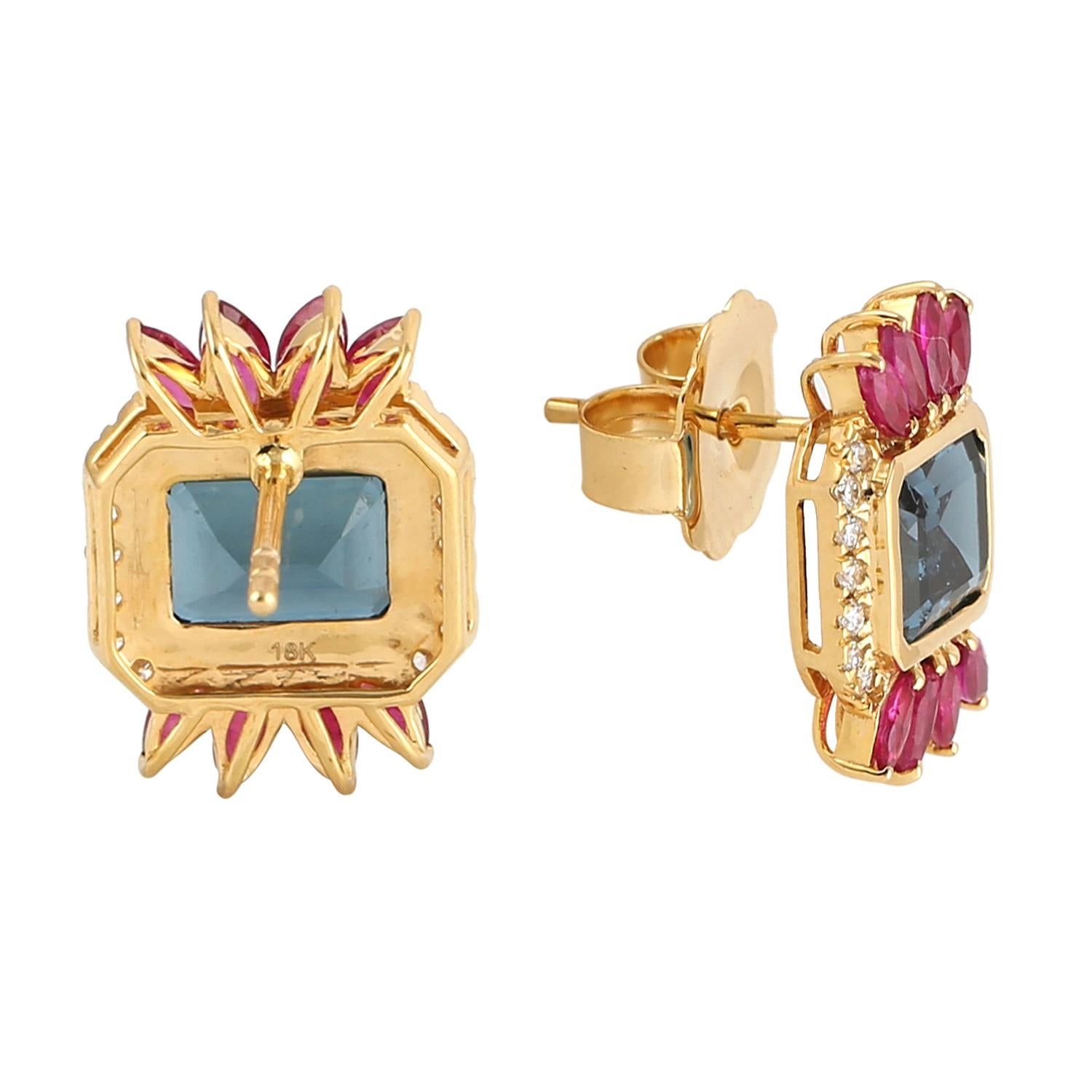 These beautiful earrings are cast in 14-karat gold. It is handset in 1.4 carats ruby, 3.75 carats topaz and illuminated with .22 carats of glittering diamonds. Also see matching ring.

The ring is a size 7 and may be resized to larger or smaller