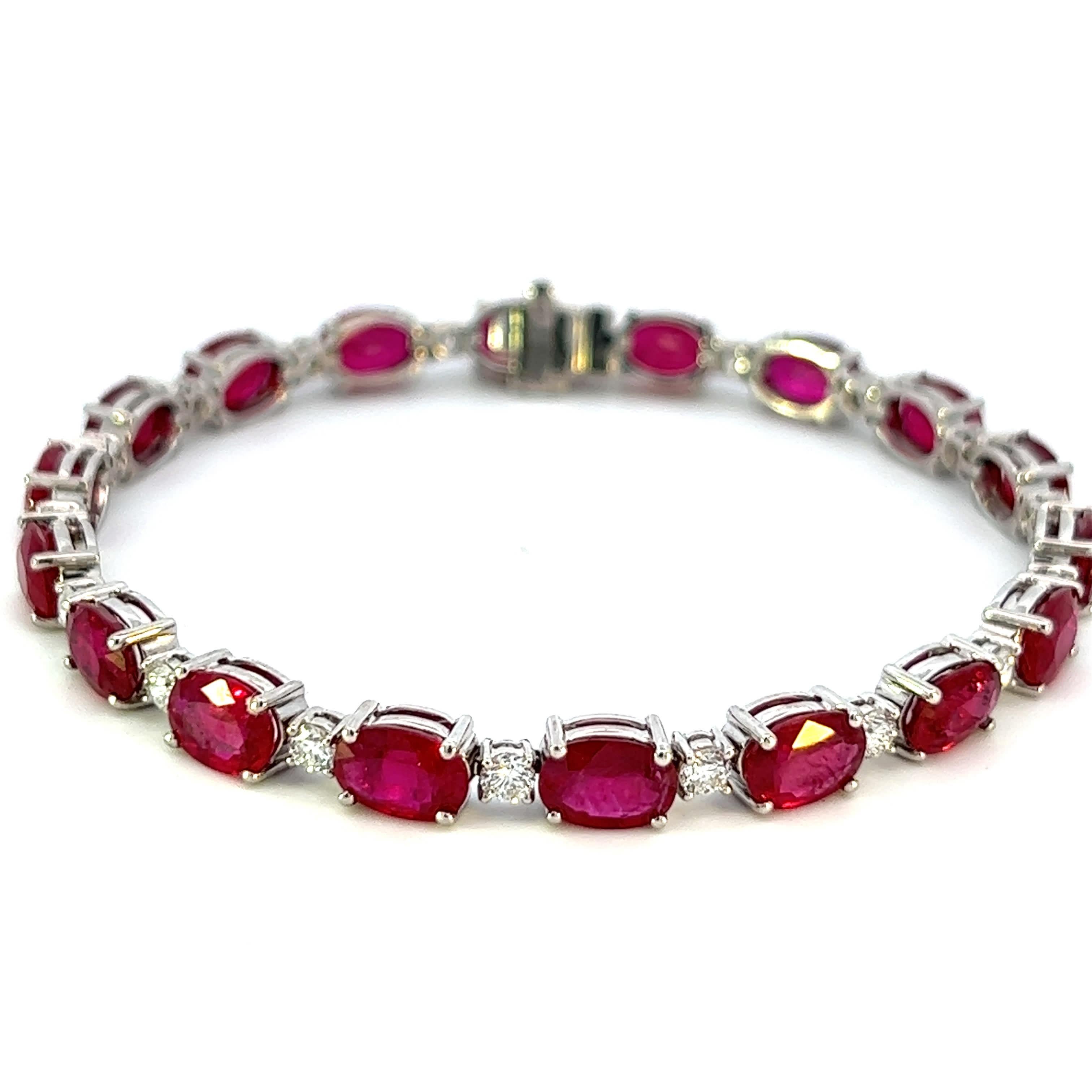 Indulge in the fiery elegance of this oval ruby bracelet. Crafted with utmost precision, it features a gleaming oval-shaped ruby as its focal point.