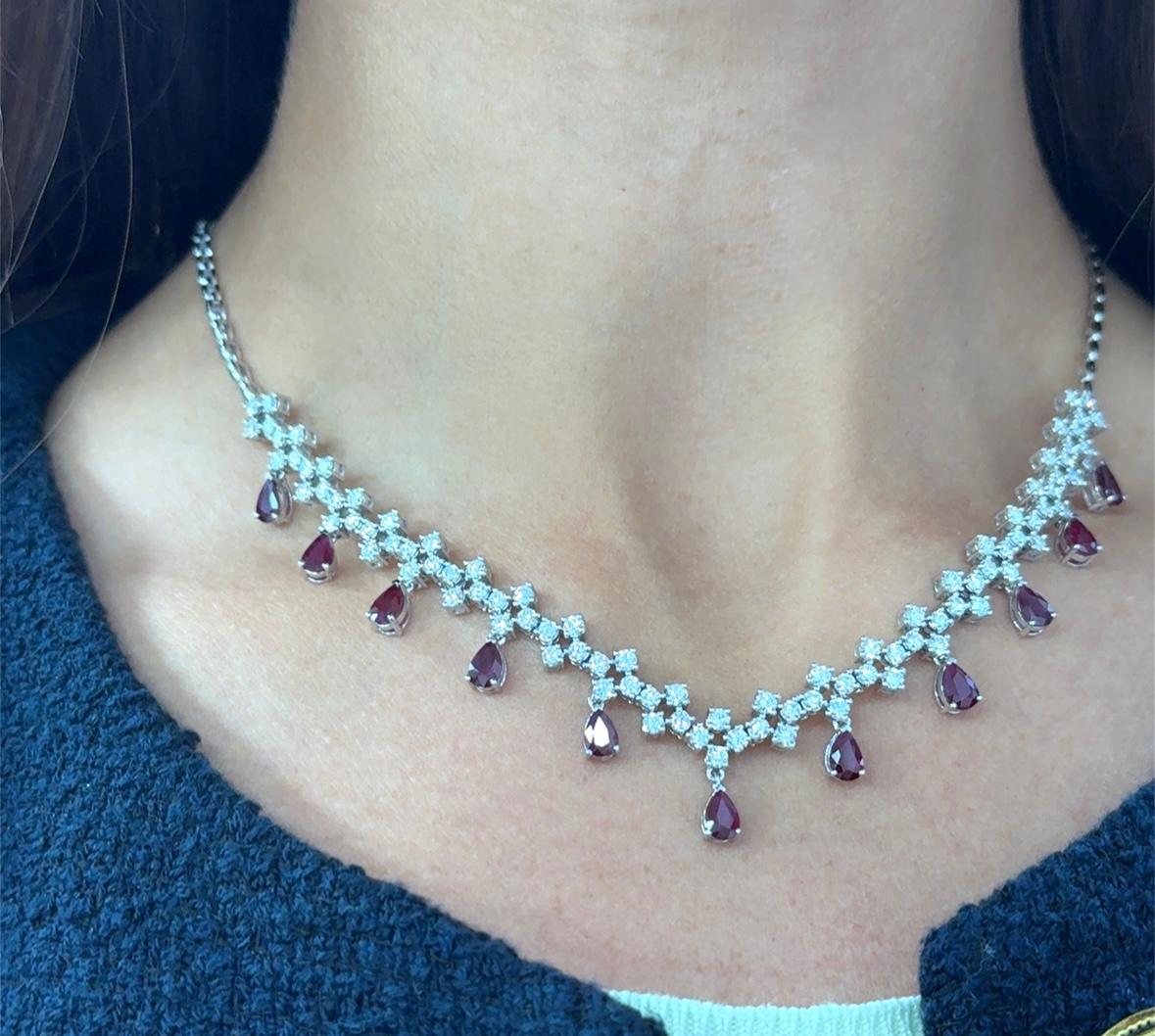 Dazzle in this exquisite 18k white gold necklace adorned with a series of deep red, pear-shaped ruby and round diamonds. Each gem is carefully selected for its clarity and intense colour. The combination of the rich pear shaped Burmese rubies, round